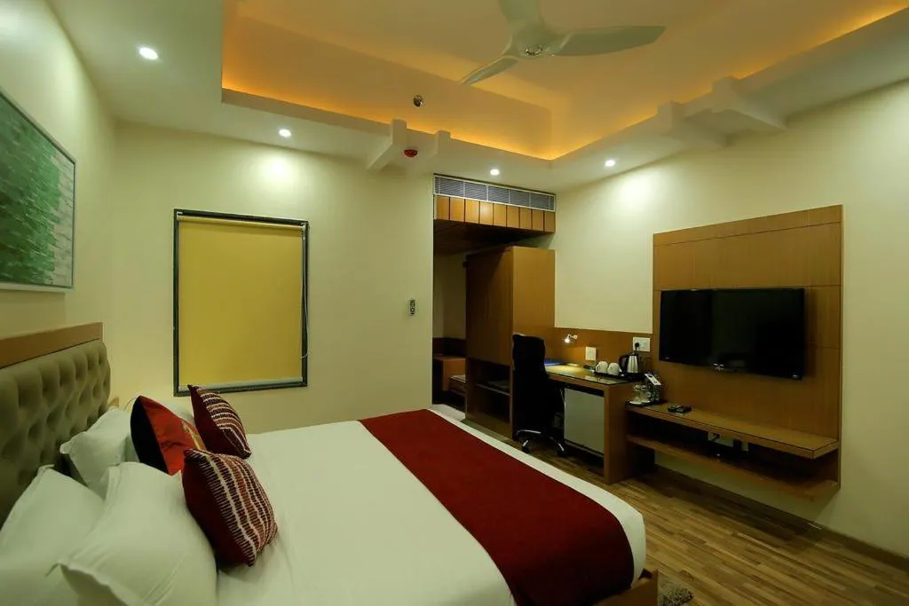 Photo of the whole room, Bed in Hotel Hampi International