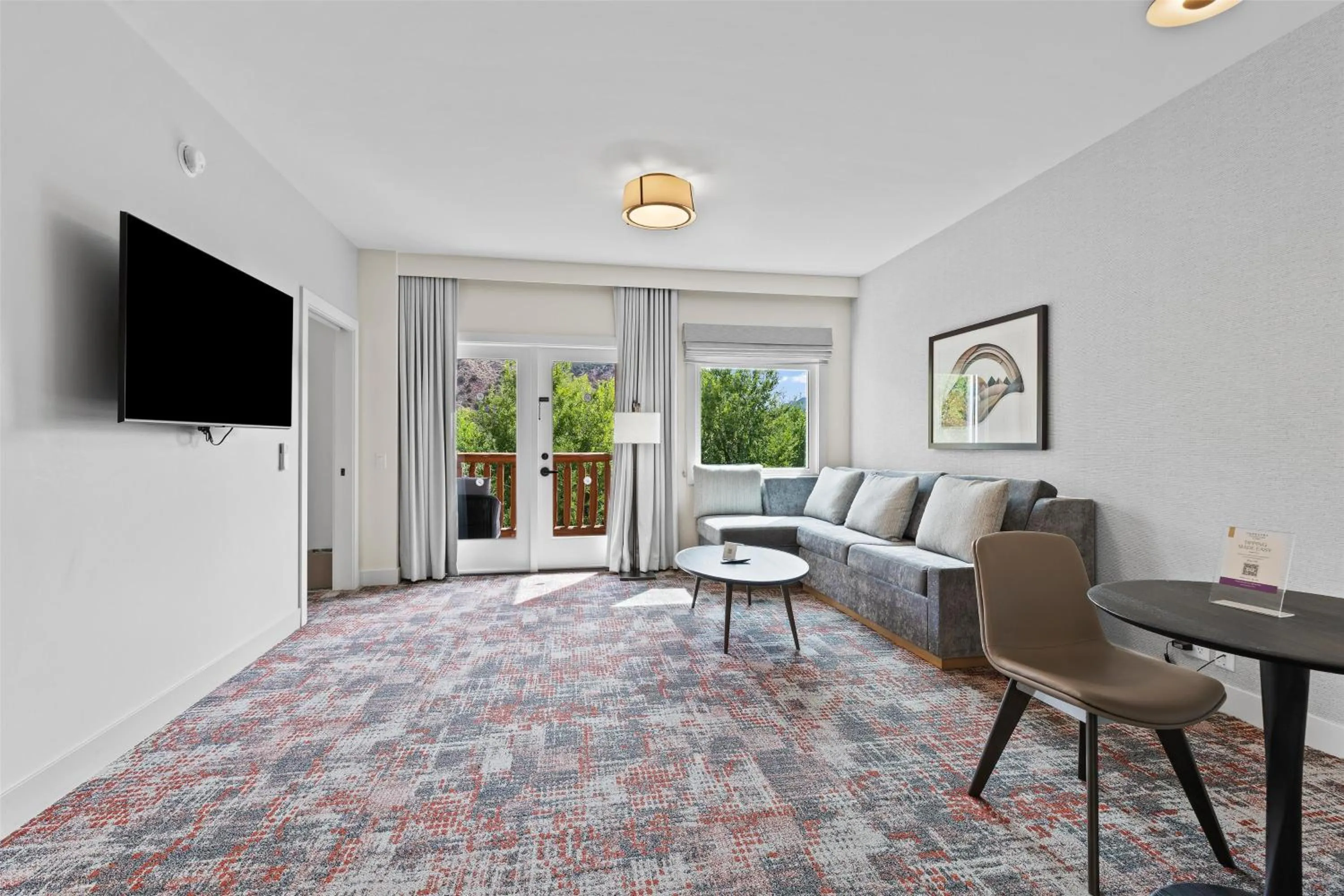 Living room in Hotel De Novo Springdale, Tapestry Collection by Hilton