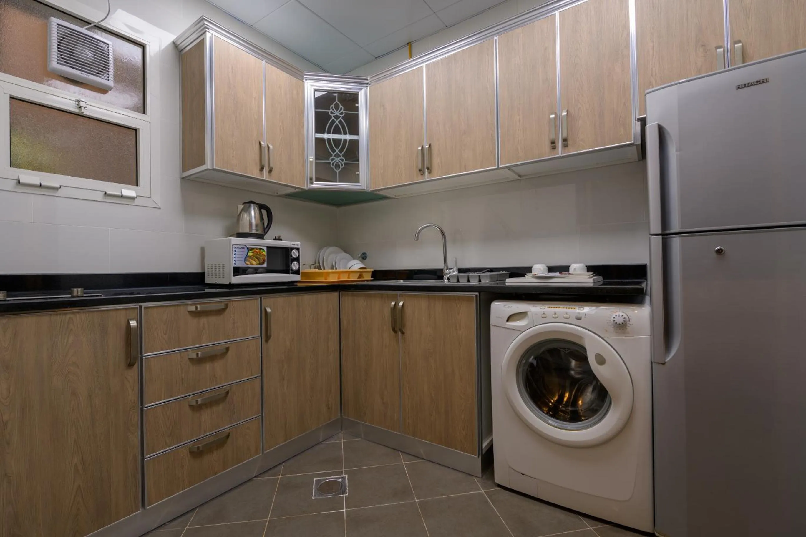 Kitchen or kitchenette in Downtown Plaza Hotel Apartment Pet Friendly