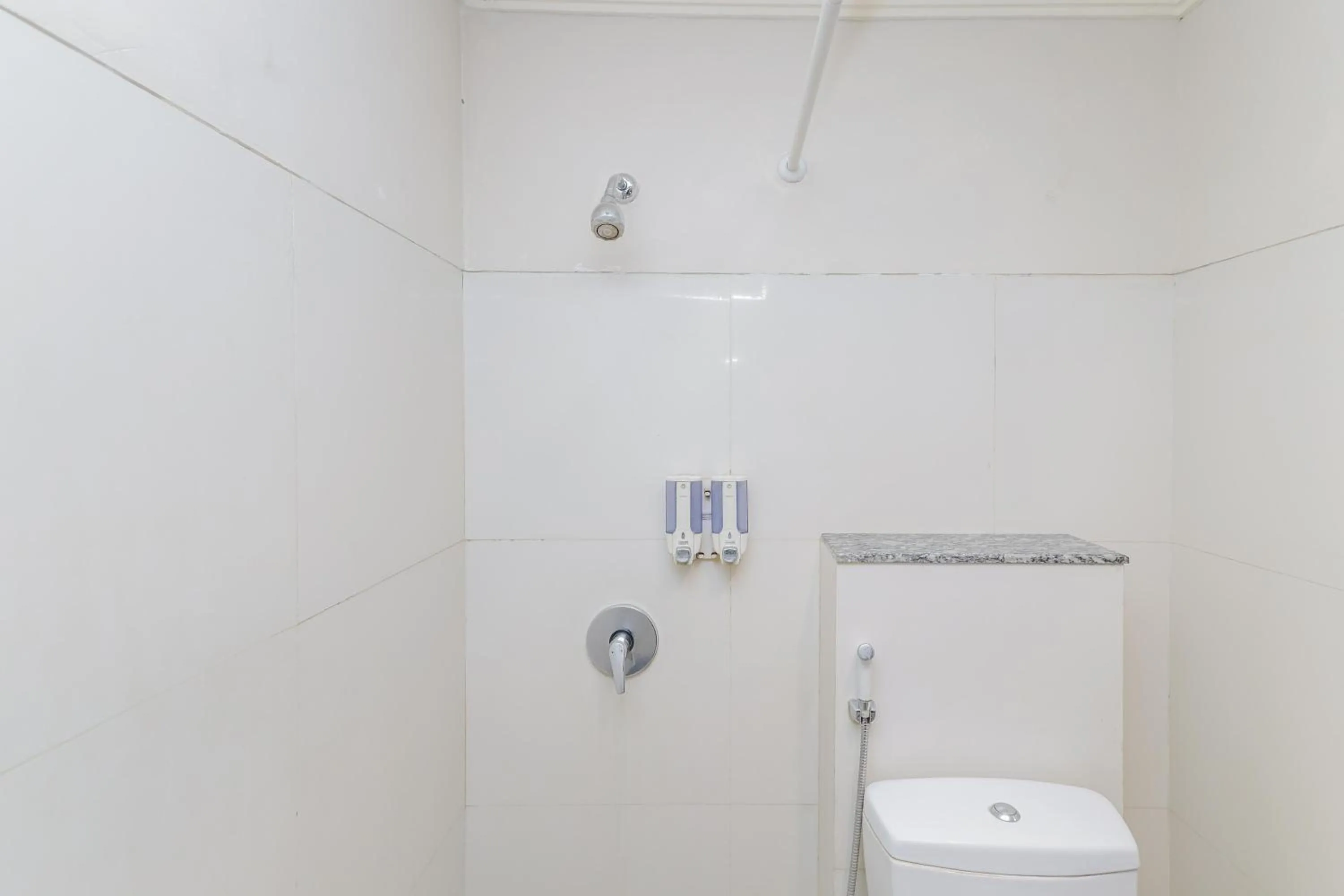 Bathroom in Urbanview Hotel Taman Suci Denpasar Bali