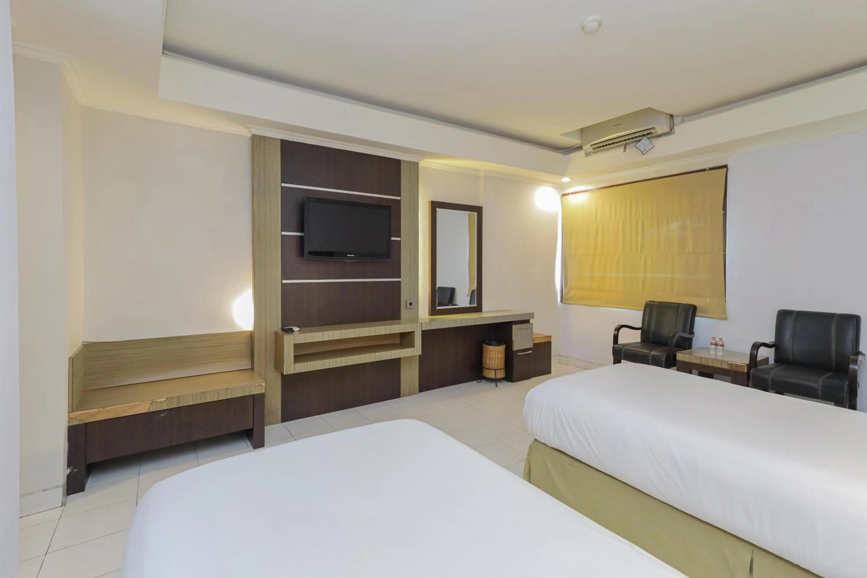 Photo of the whole room, Bed in Urbanview Hotel Taman Suci Denpasar Bali