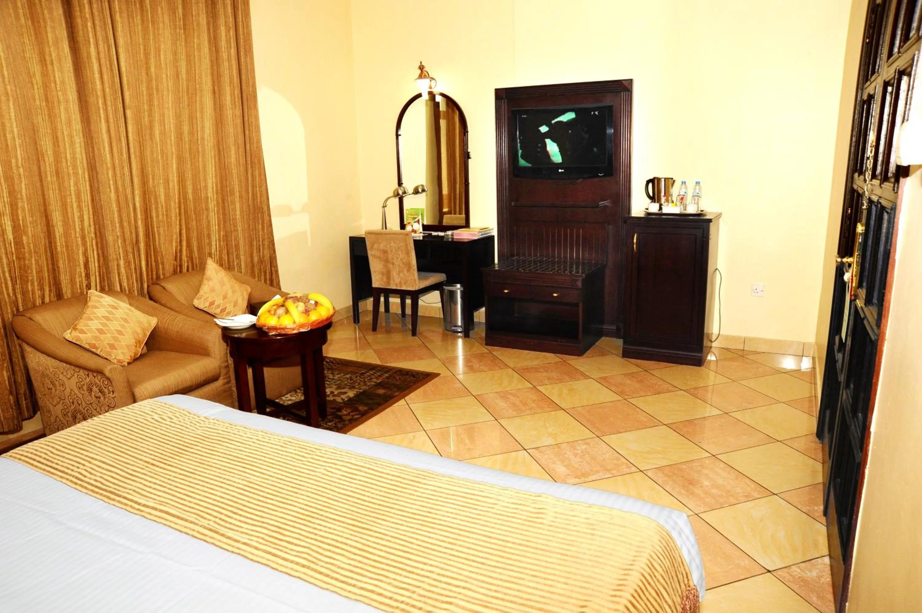 Bed in Al Jazeera Royal Hotel