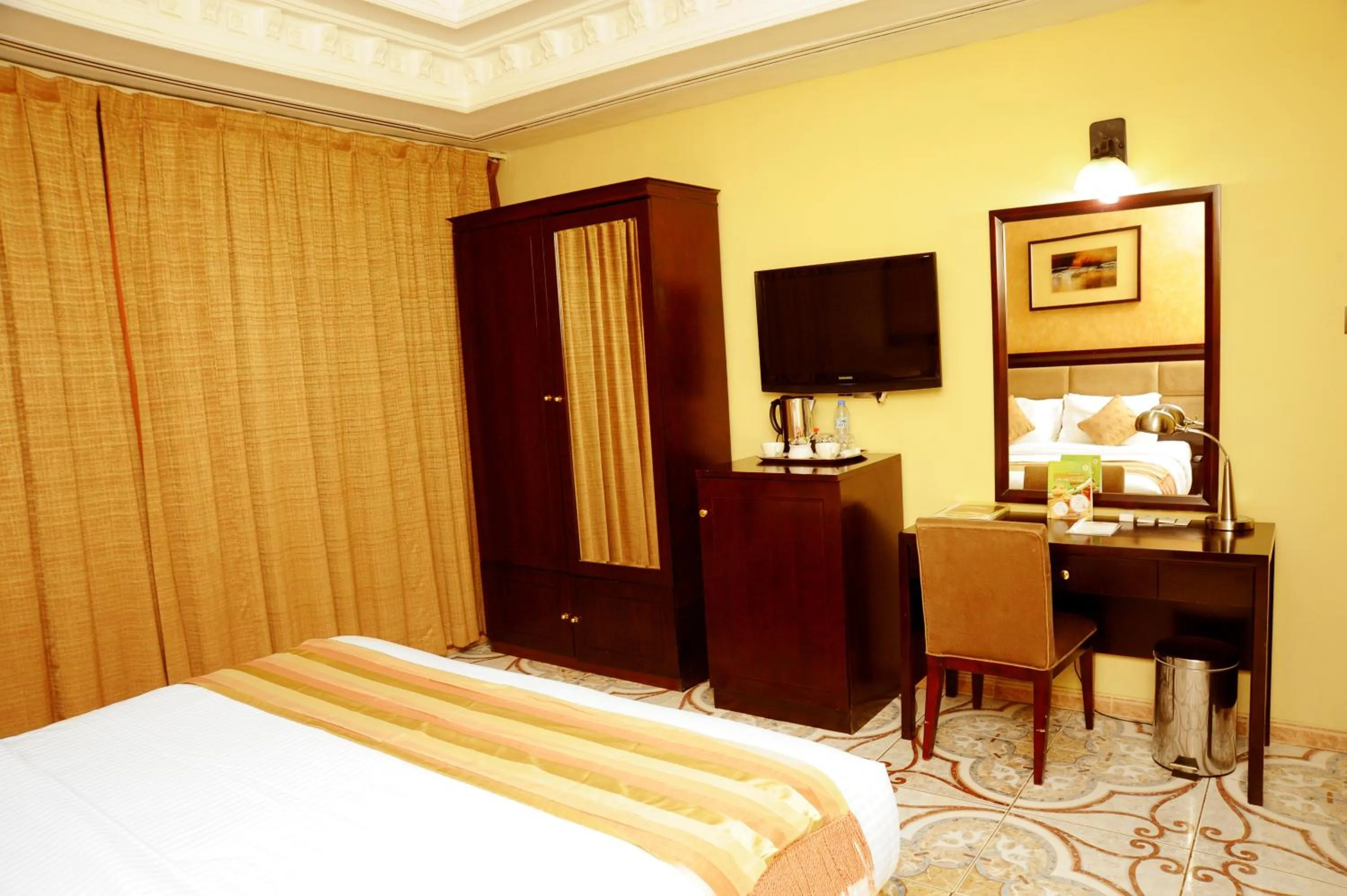 Bed in Al Jazeera Royal Hotel