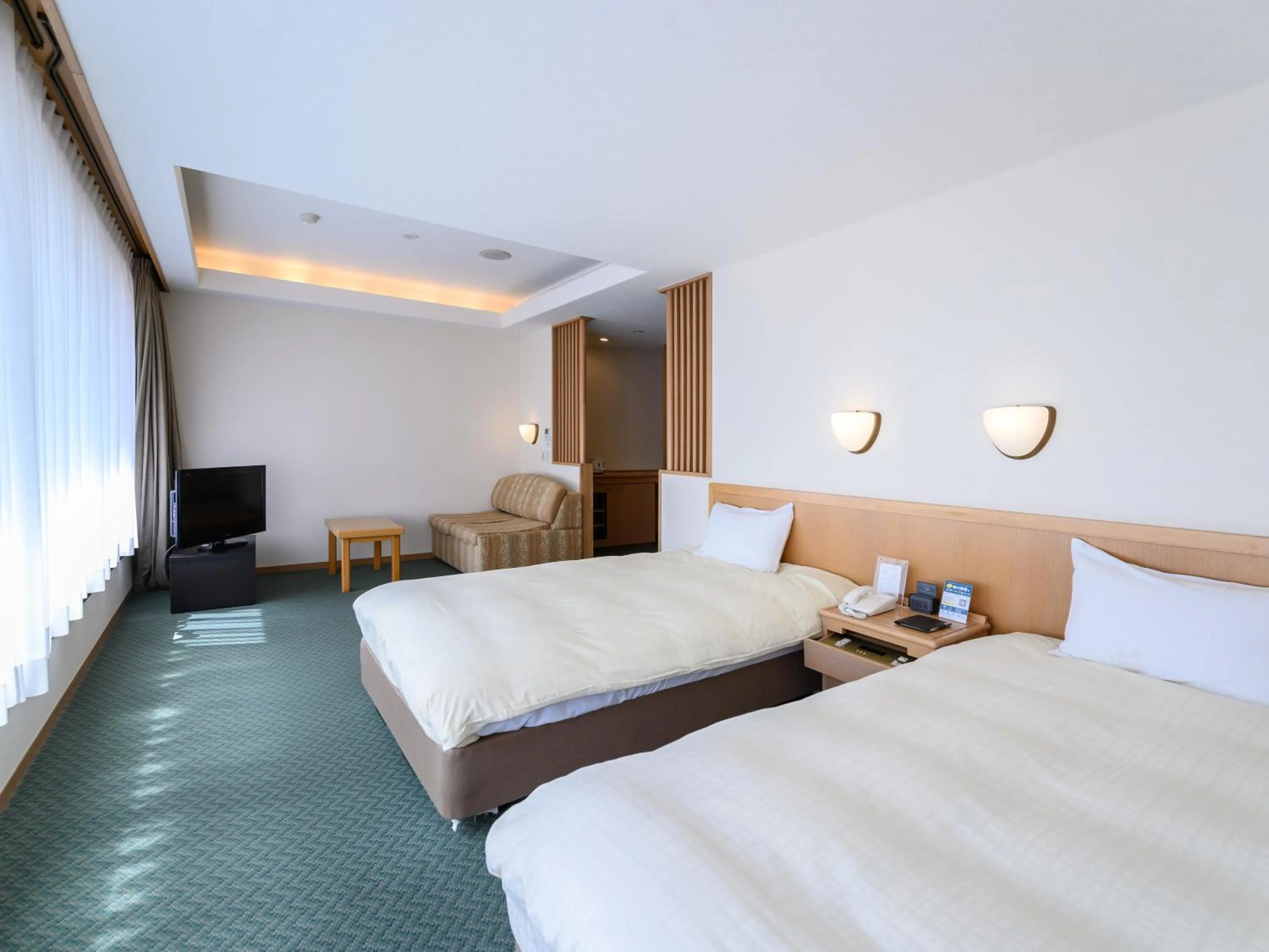 Bed in Nemu Resort Hotel Nemu