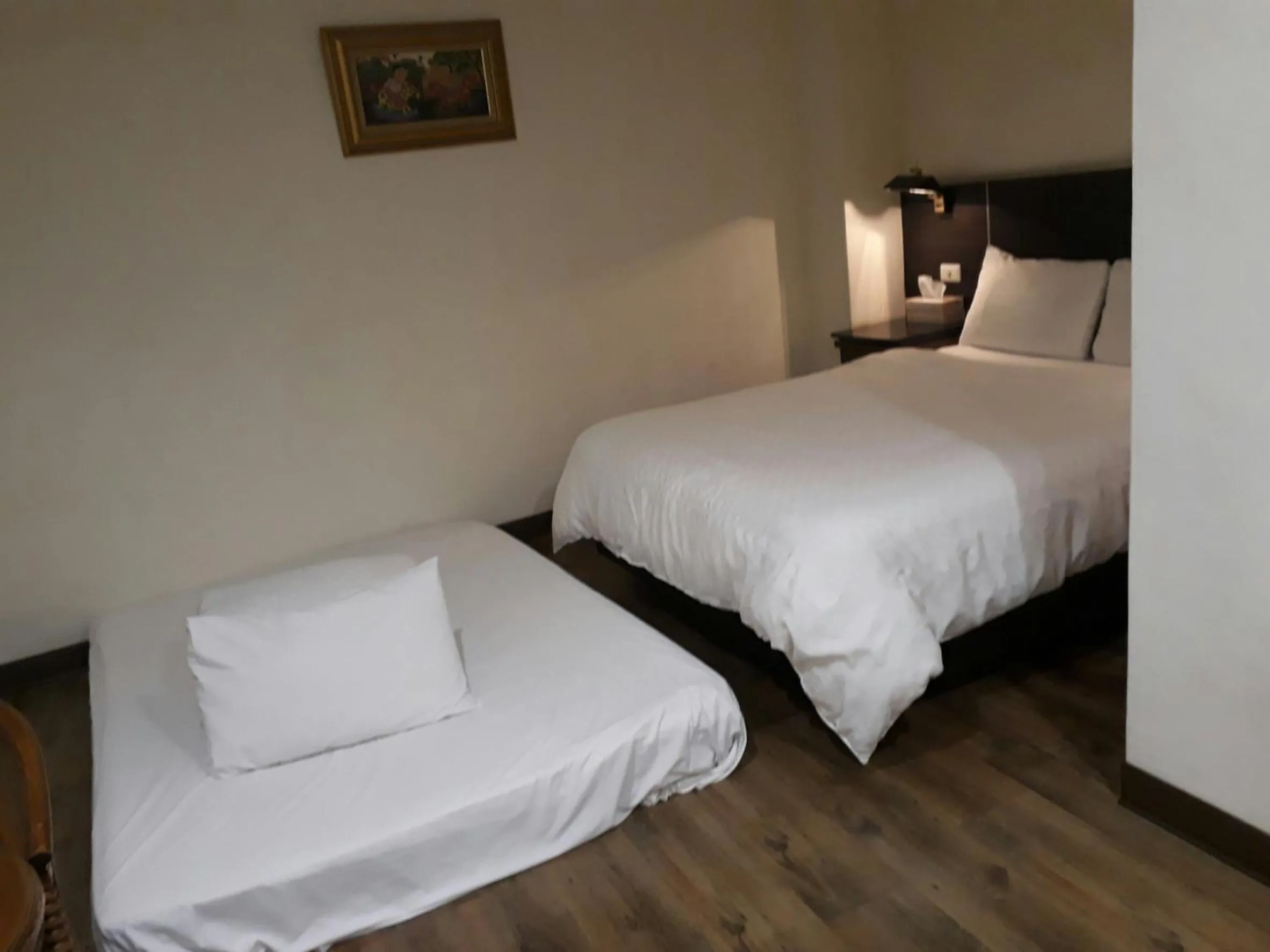 Bed in Hua Tai Hotel