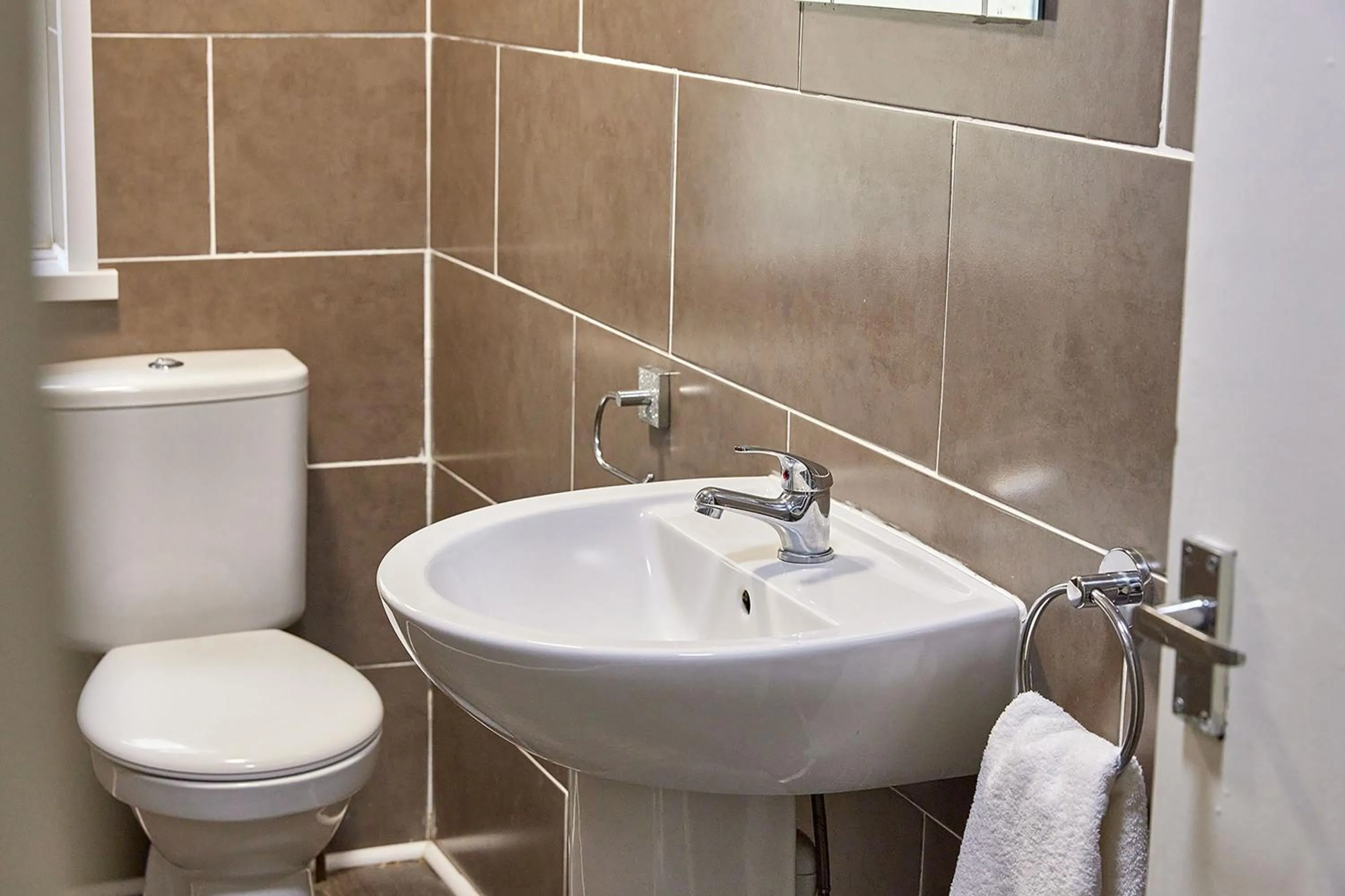 Toilet in Pleasure Holiday Apartments