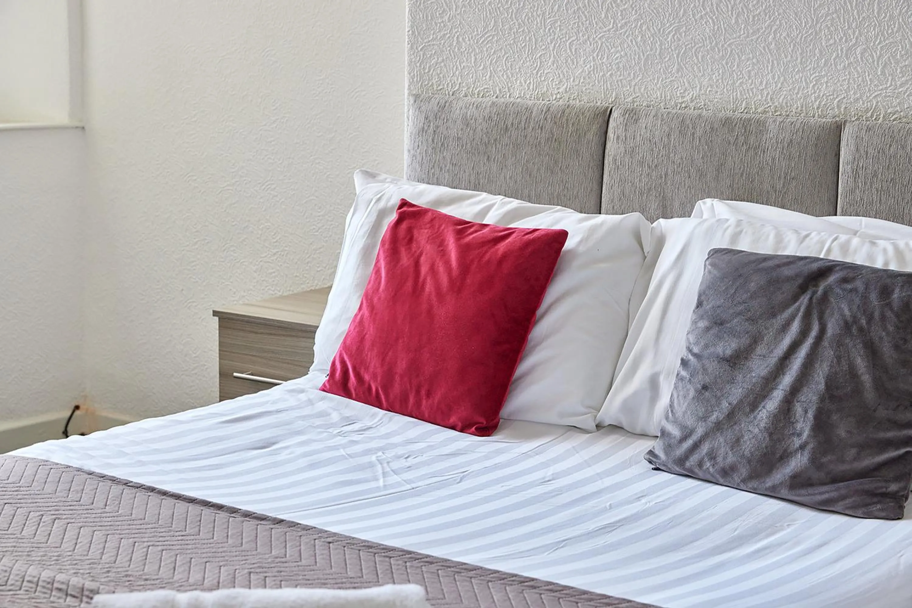 Bed in Pleasure Holiday Apartments