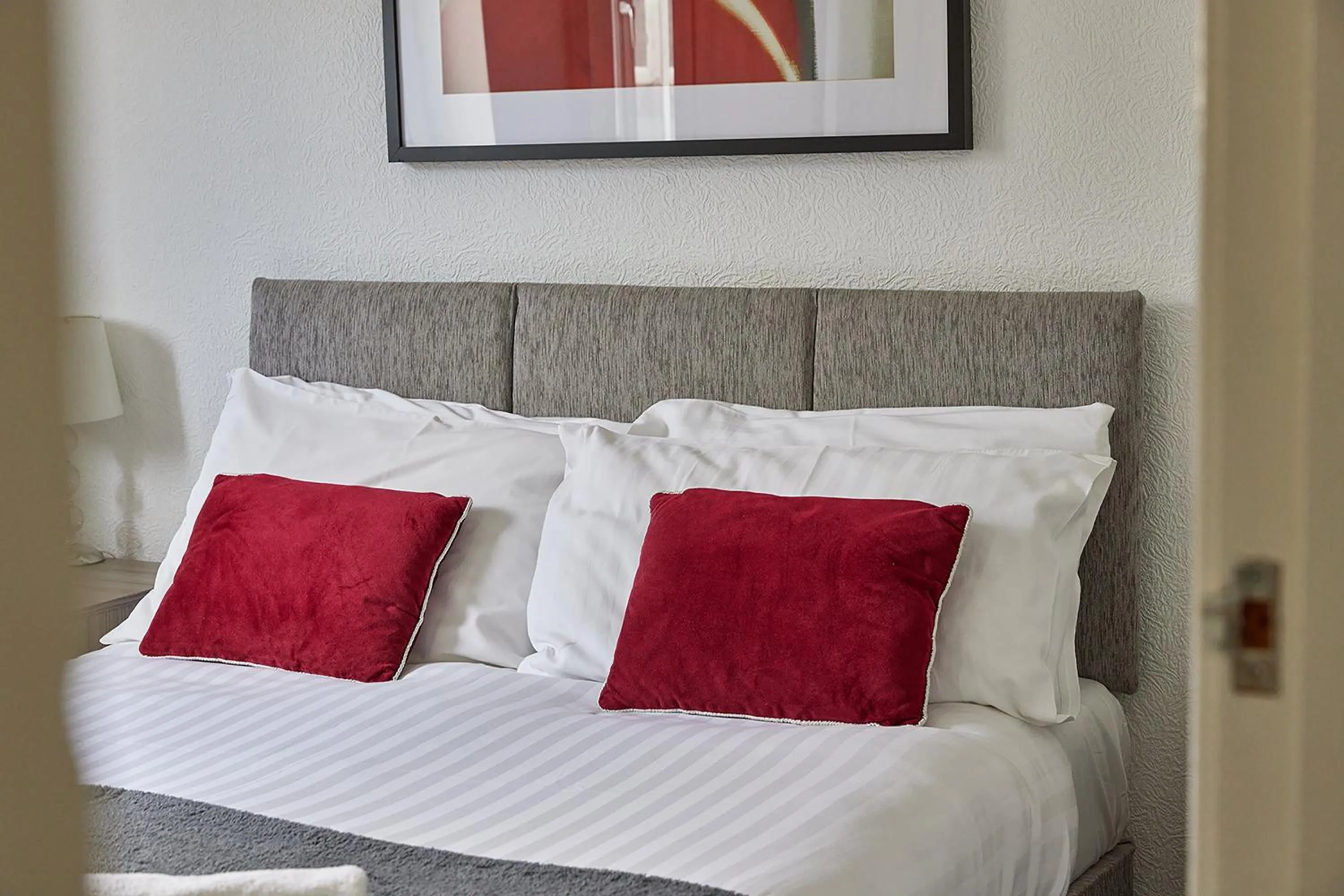 Bed in Pleasure Holiday Apartments