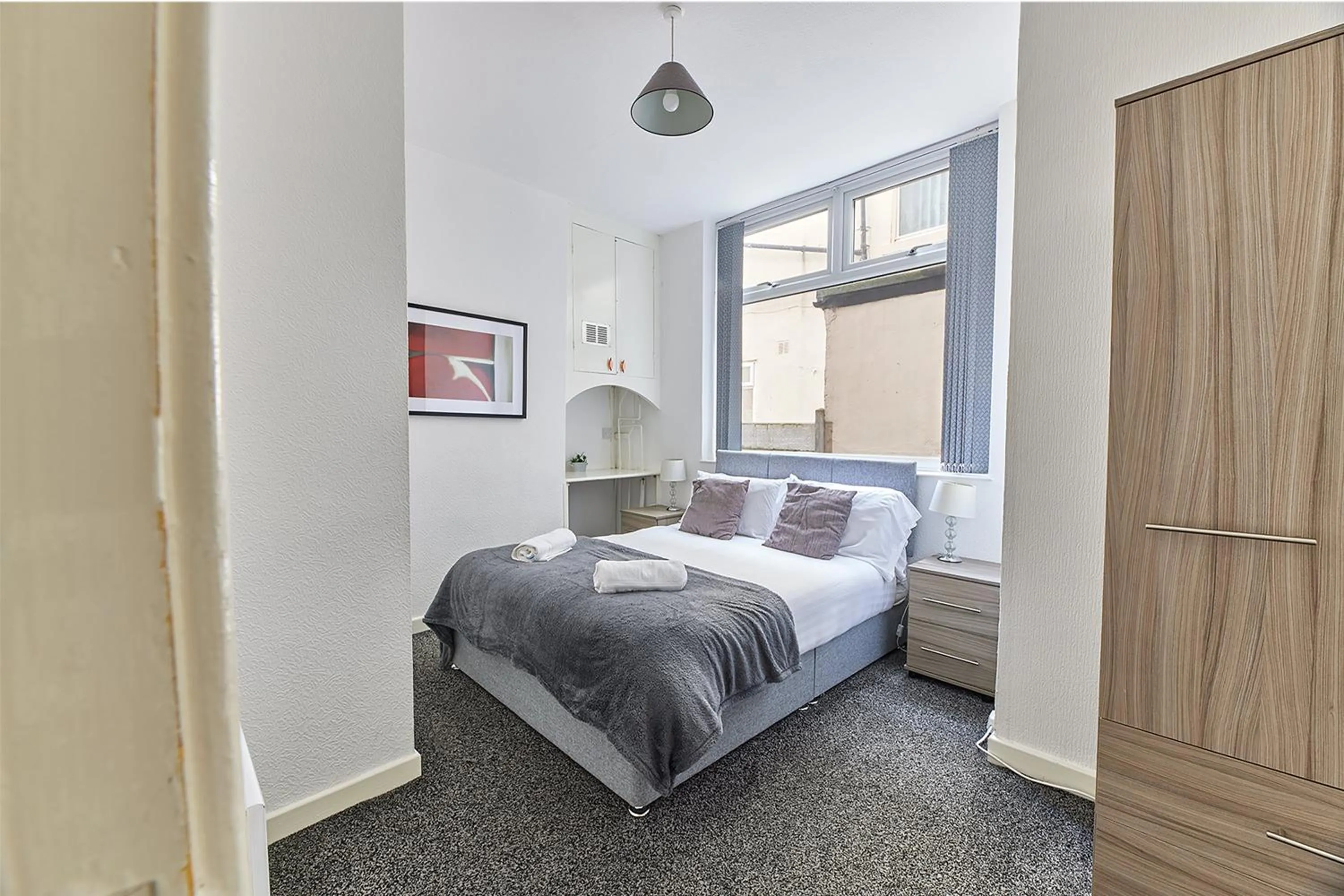 Bed in Pleasure Holiday Apartments