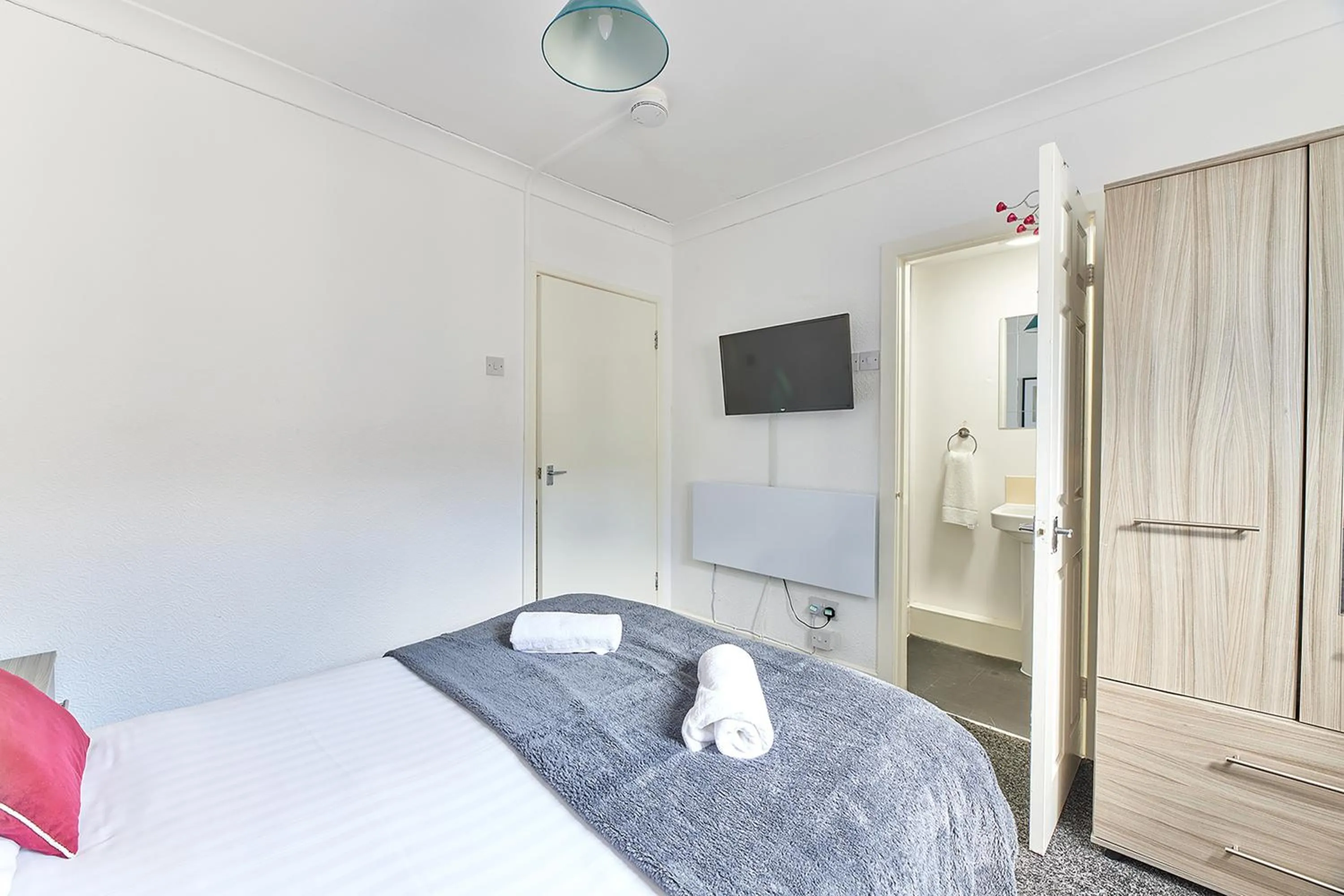 Bed in Pleasure Holiday Apartments