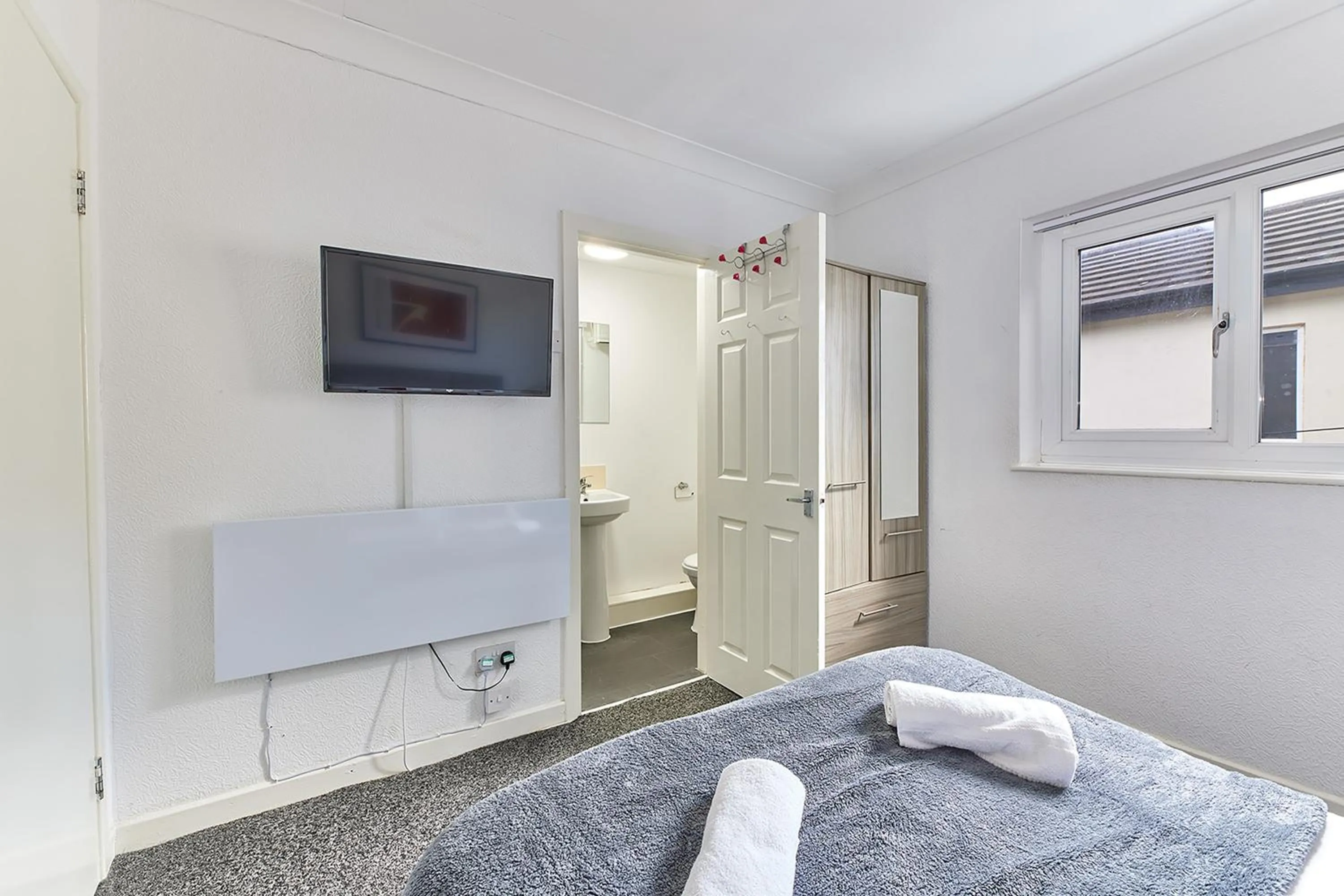 Bed in Pleasure Holiday Apartments