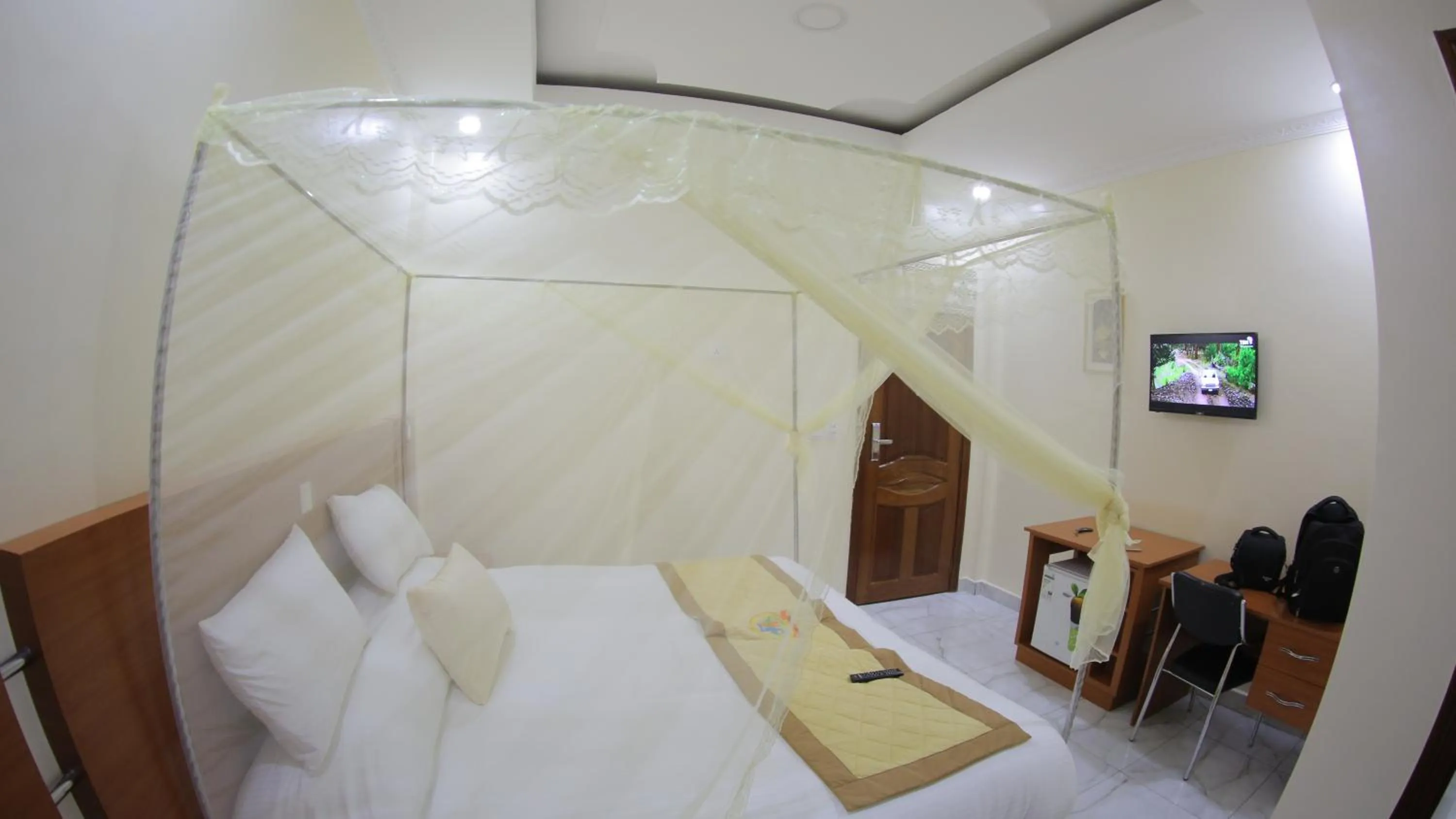 Communal lounge/ TV room, Bed in FATIMA HOTEL Ltd