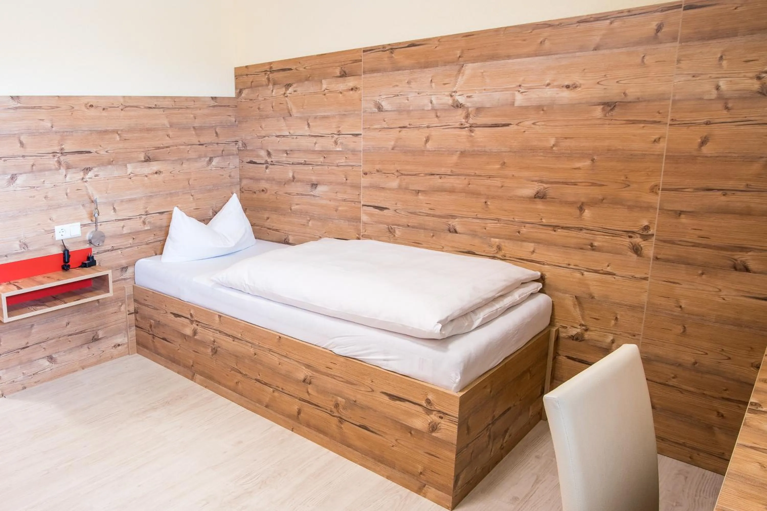 Bed in Hotel Schweizerhof