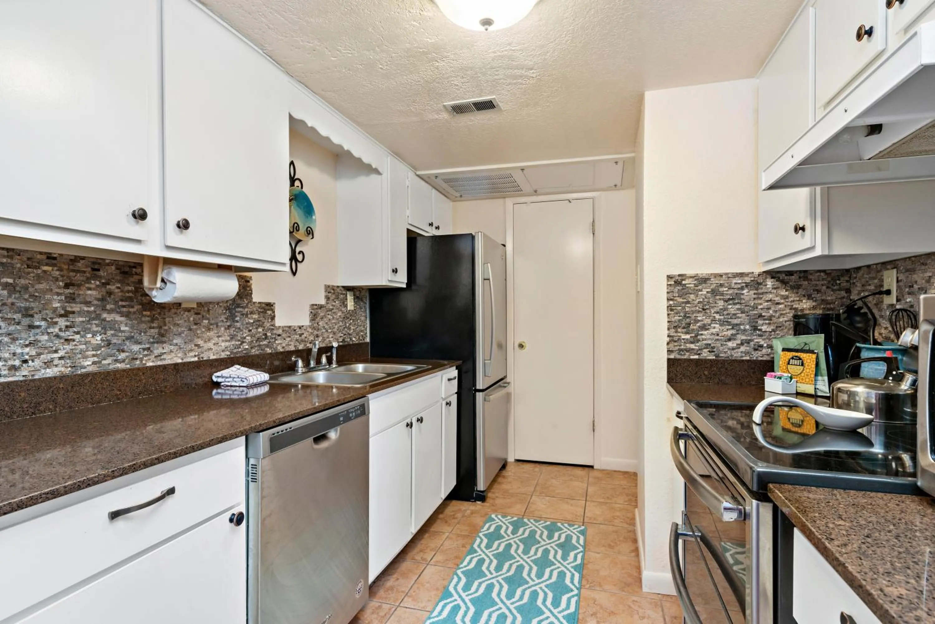 kitchen in Fort Marcy Suites by All Seasons Resort Lodging
