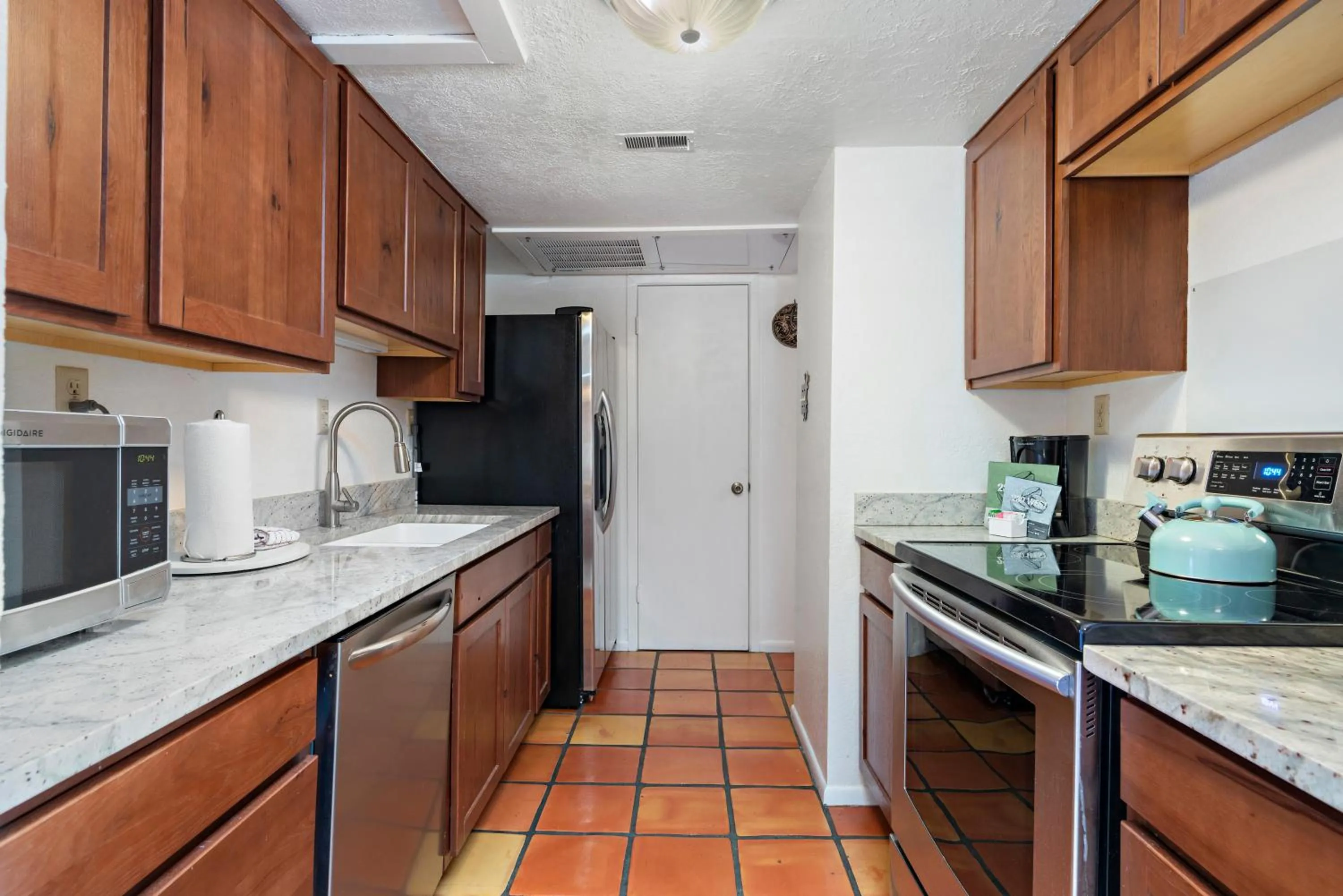kitchen in Fort Marcy Suites by All Seasons Resort Lodging