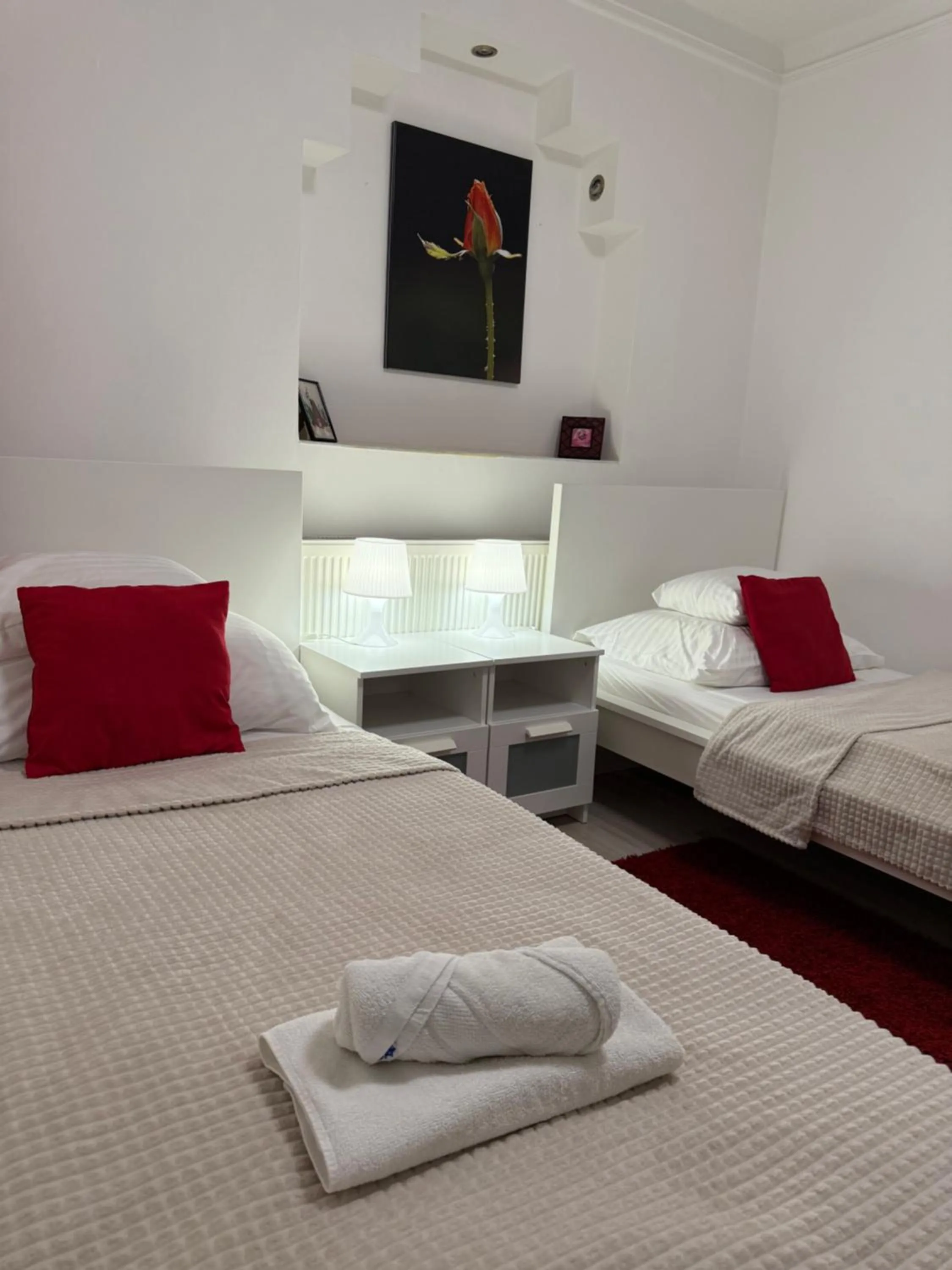 Bed in Le Rose Suites & Park Hotel