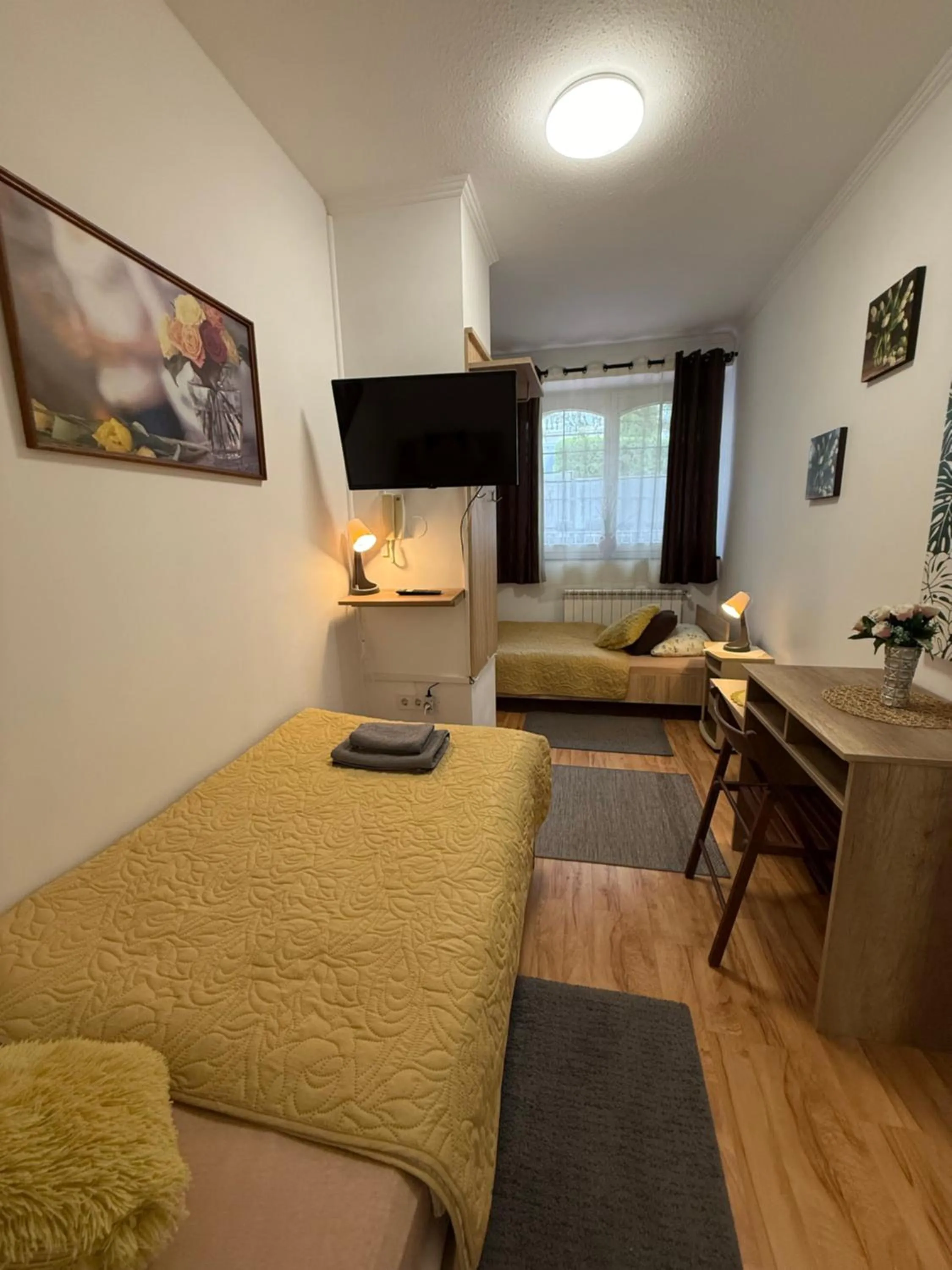 Bed in Le Rose Suites & Park Hotel