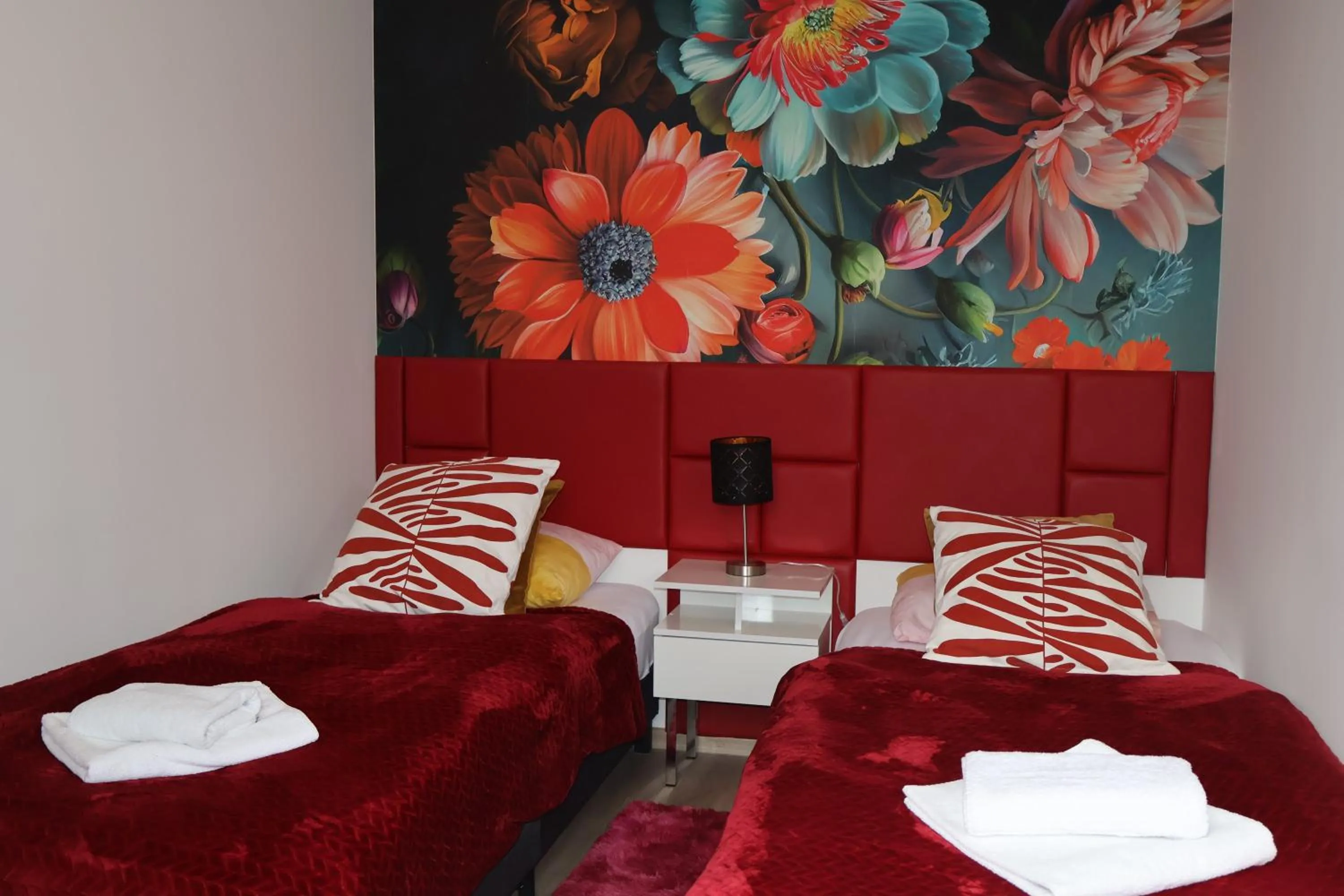 Bed in Le Rose Suites & Park Hotel