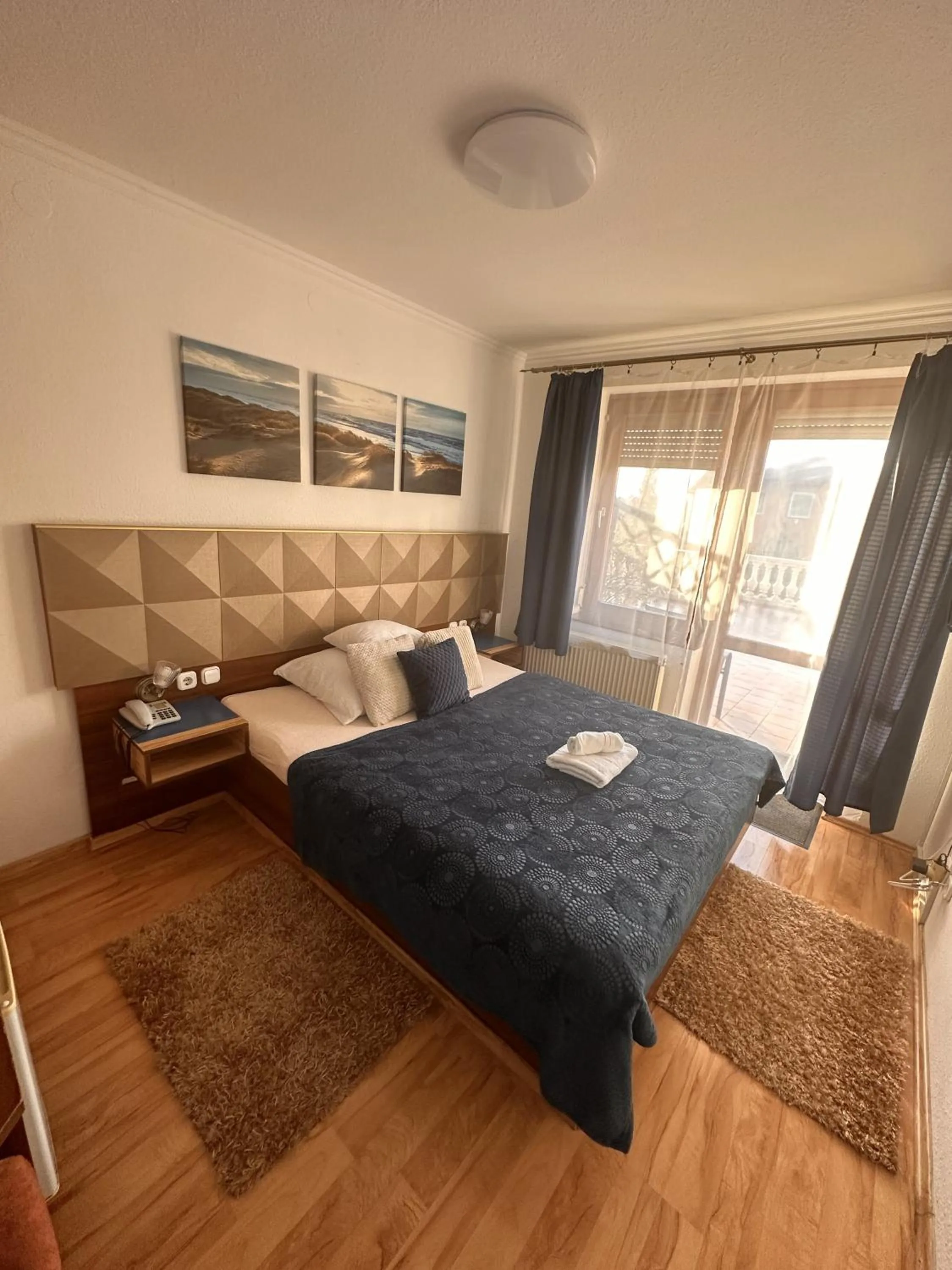 Bed in Le Rose Suites & Park Hotel