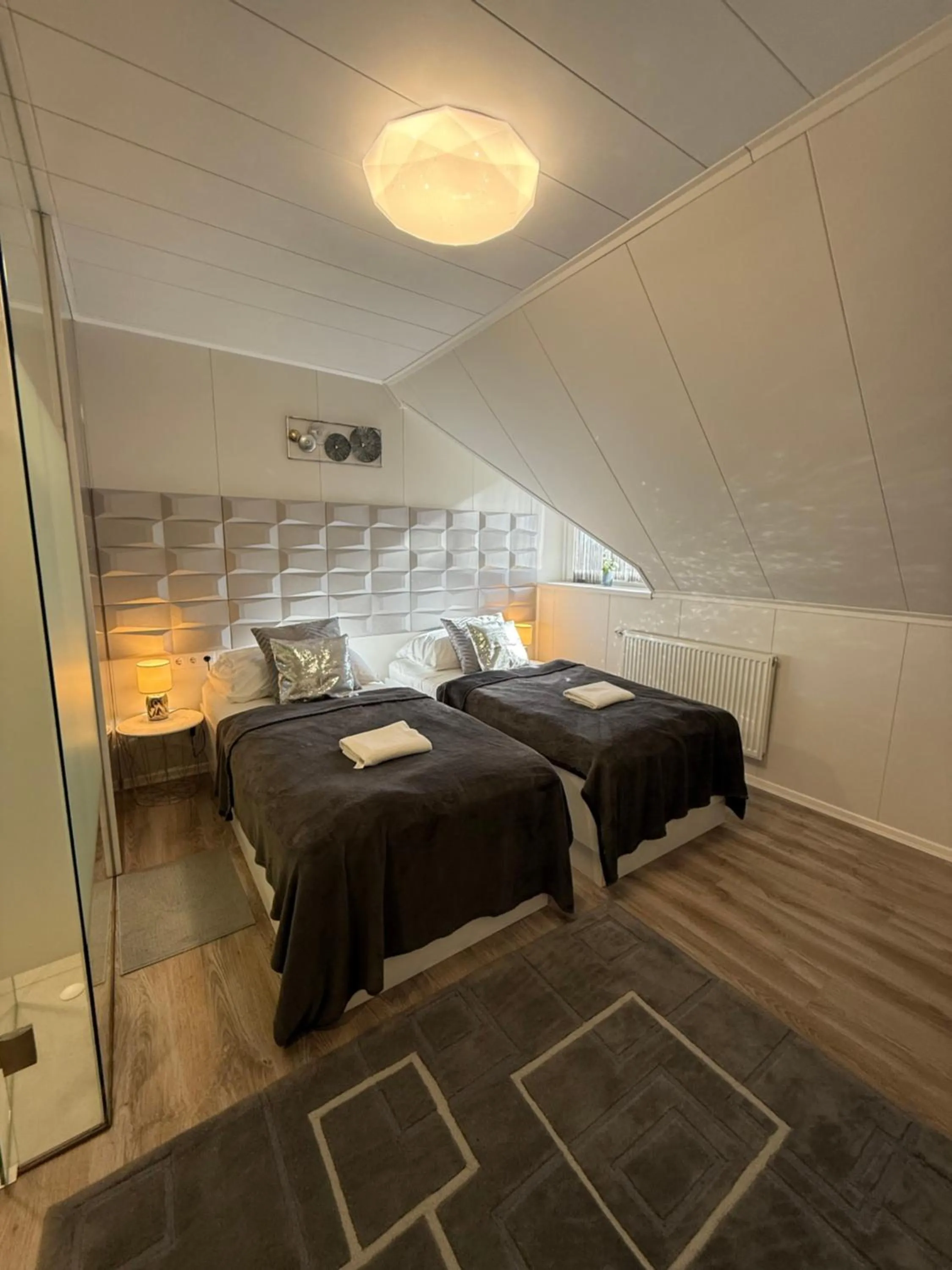 Bed in Le Rose Suites & Park Hotel