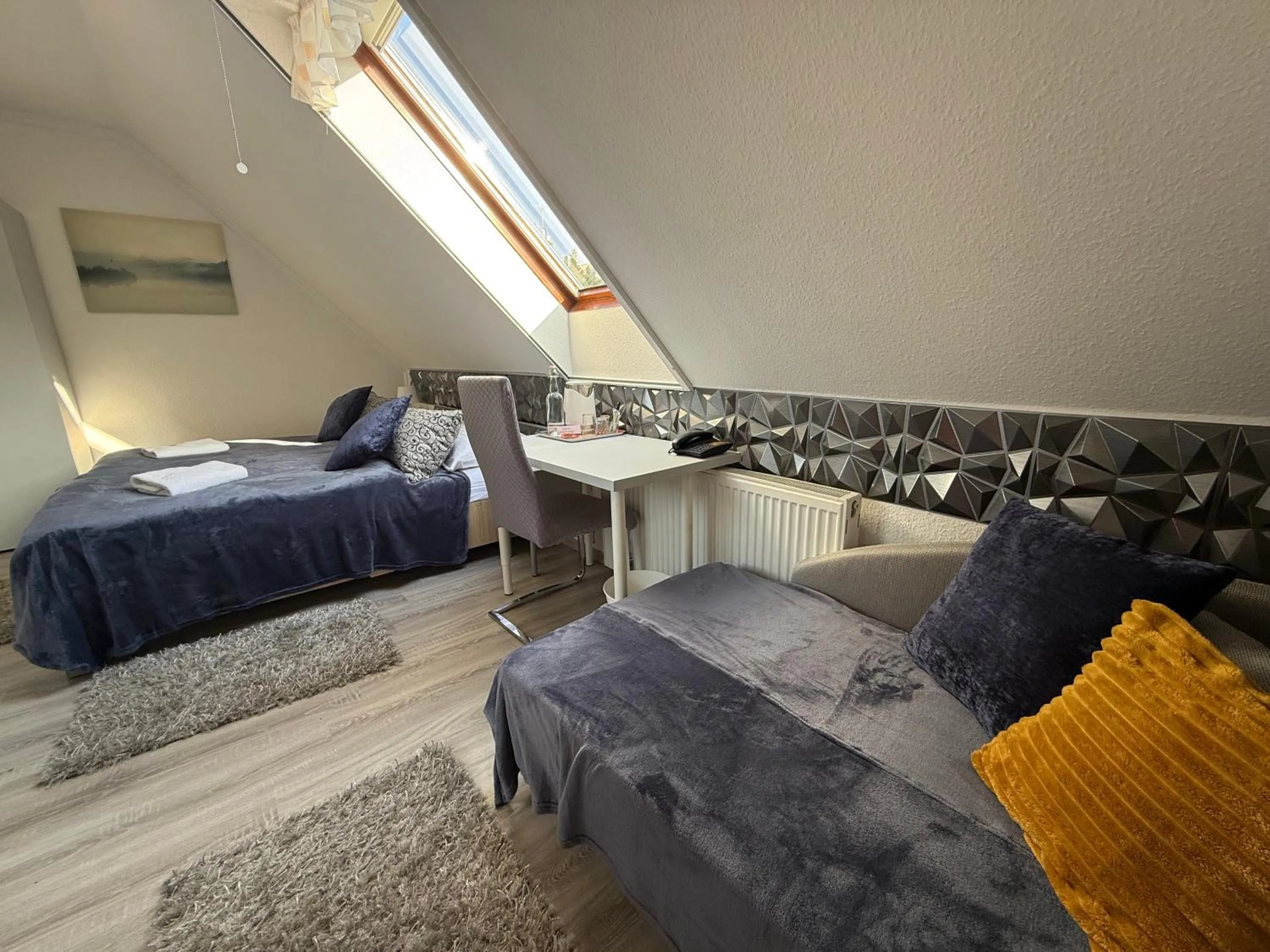 Bed in Le Rose Suites & Park Hotel