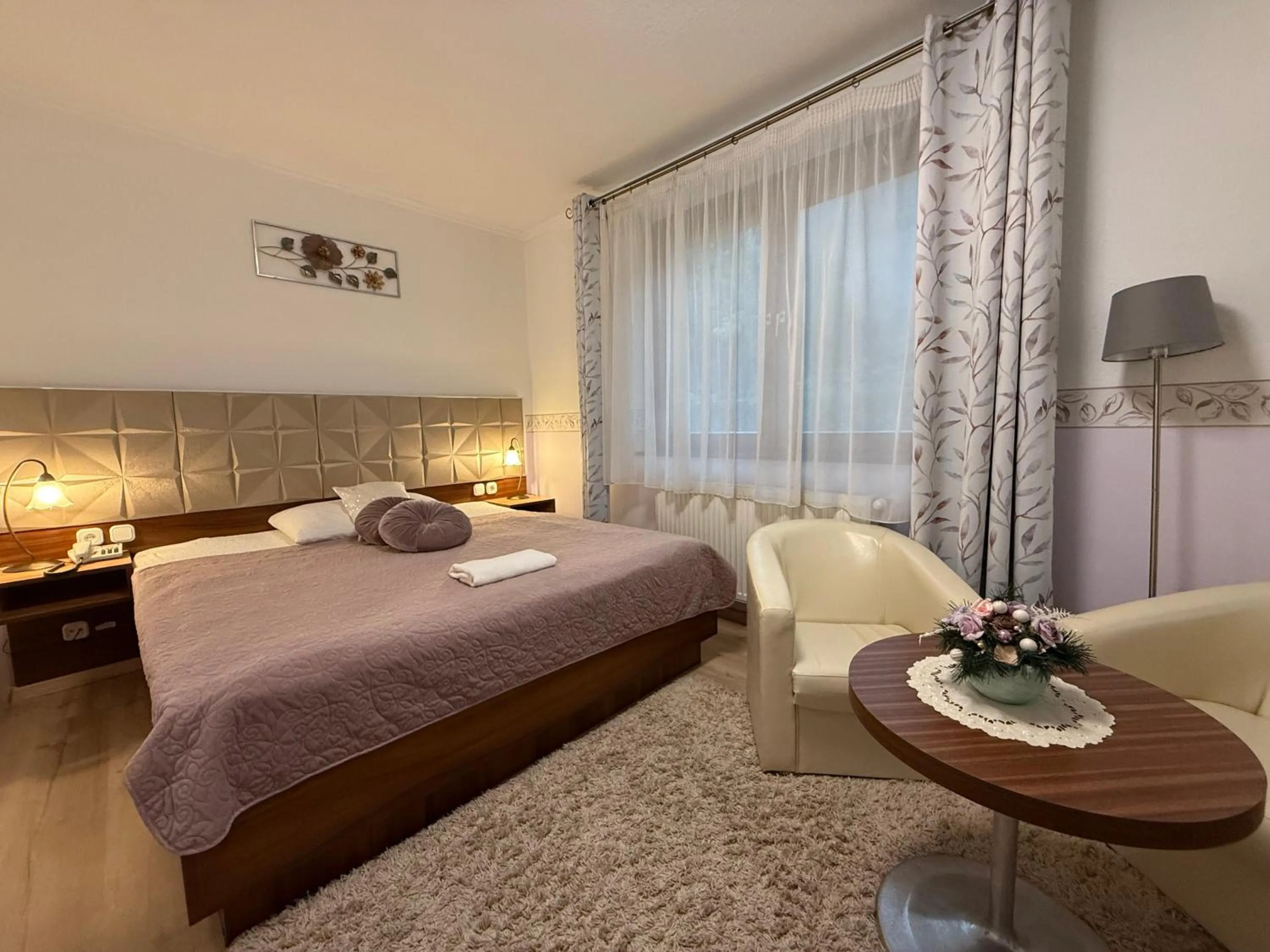 Bed in Le Rose Suites & Park Hotel