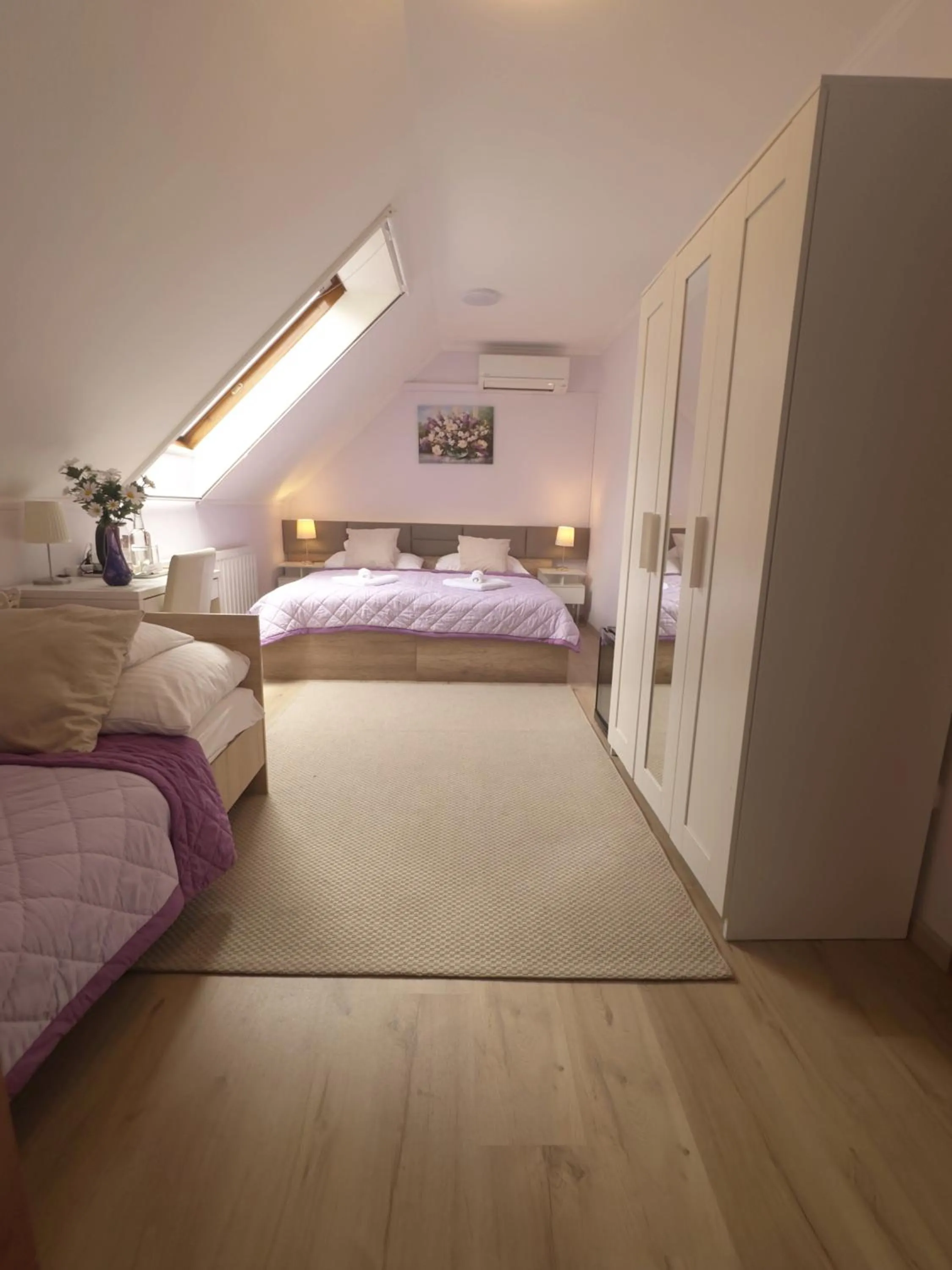 Bed in Le Rose Suites & Park Hotel