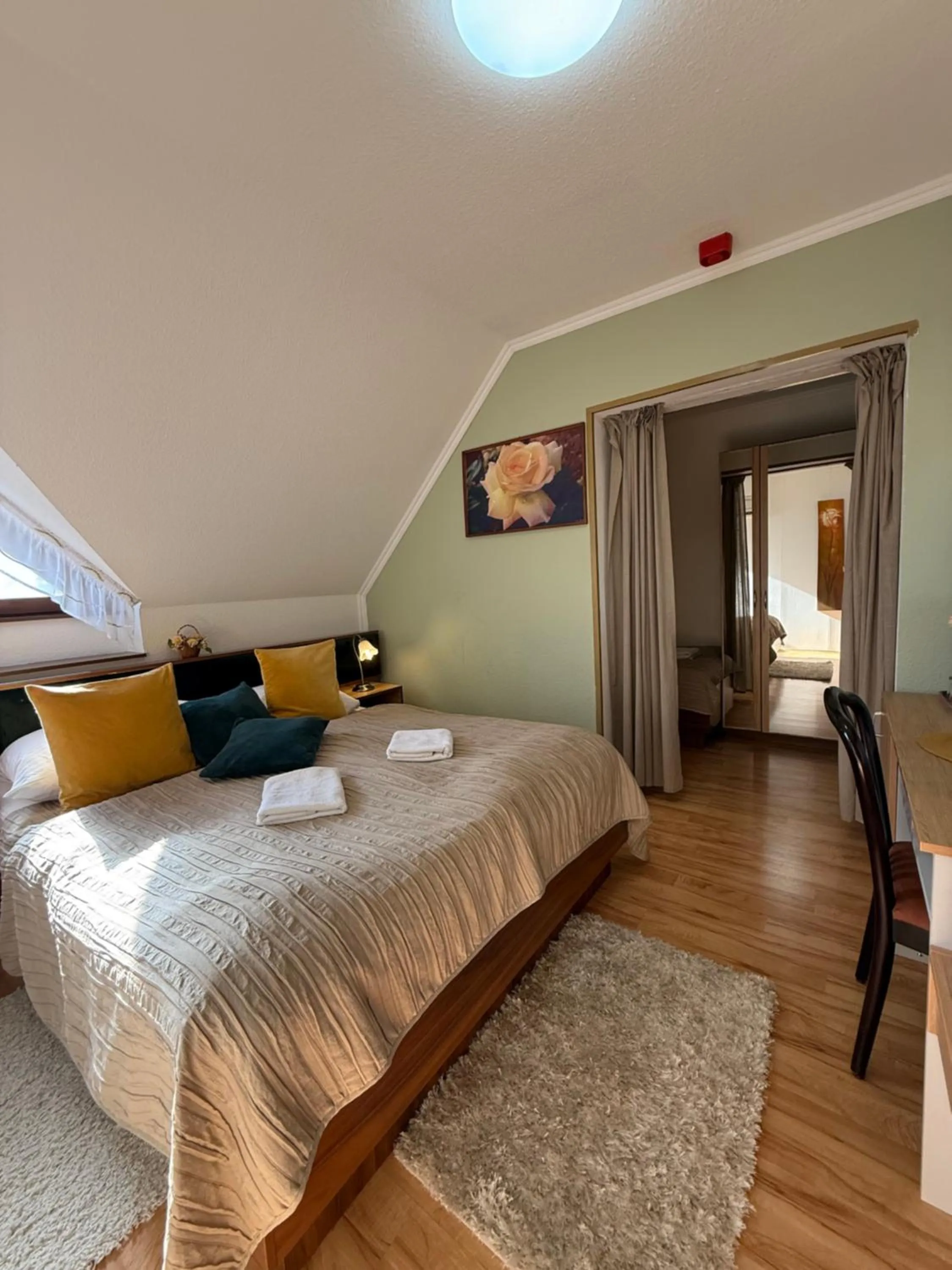 Bed in Le Rose Suites & Park Hotel