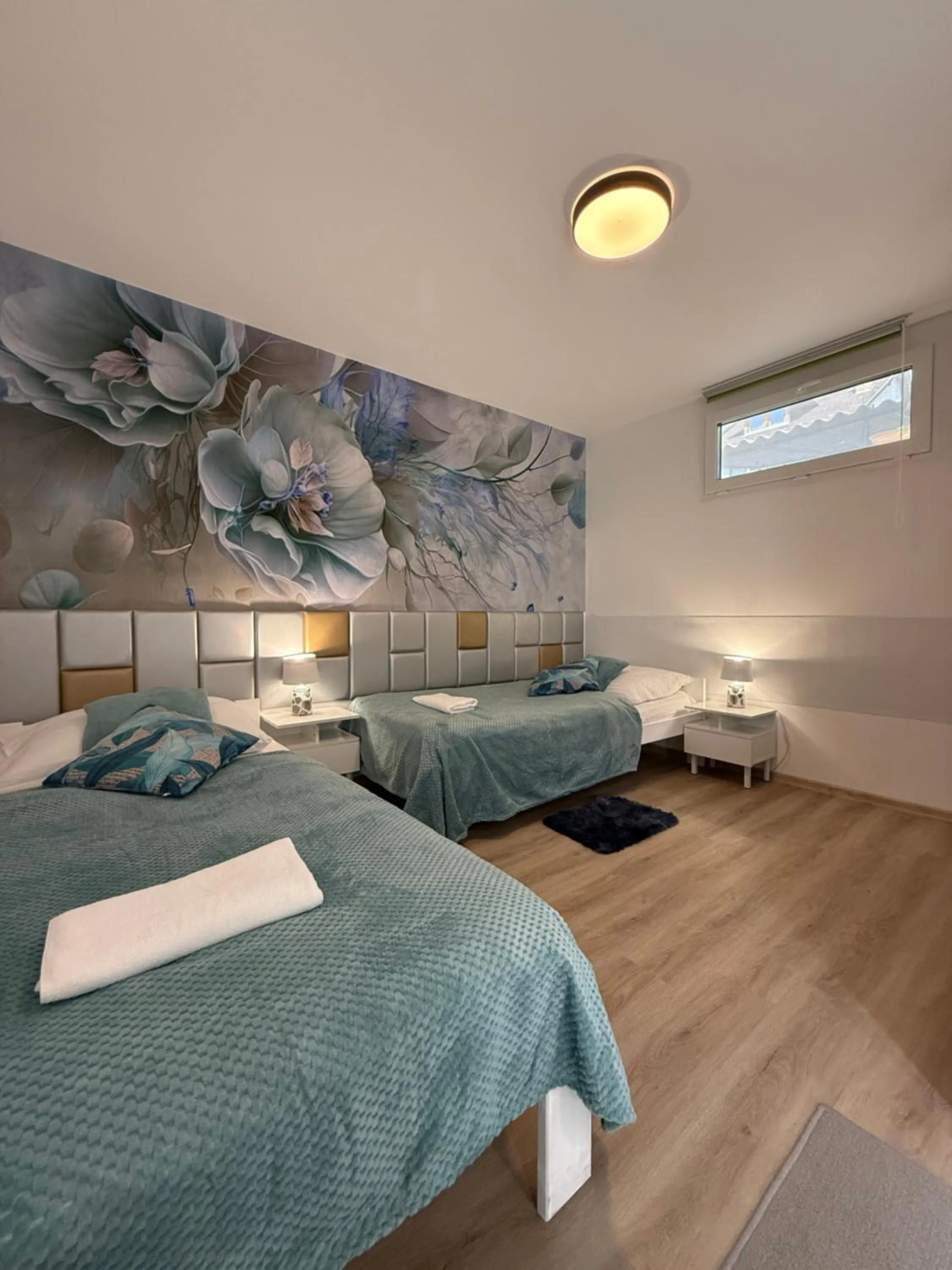 Bed in Le Rose Suites & Park Hotel