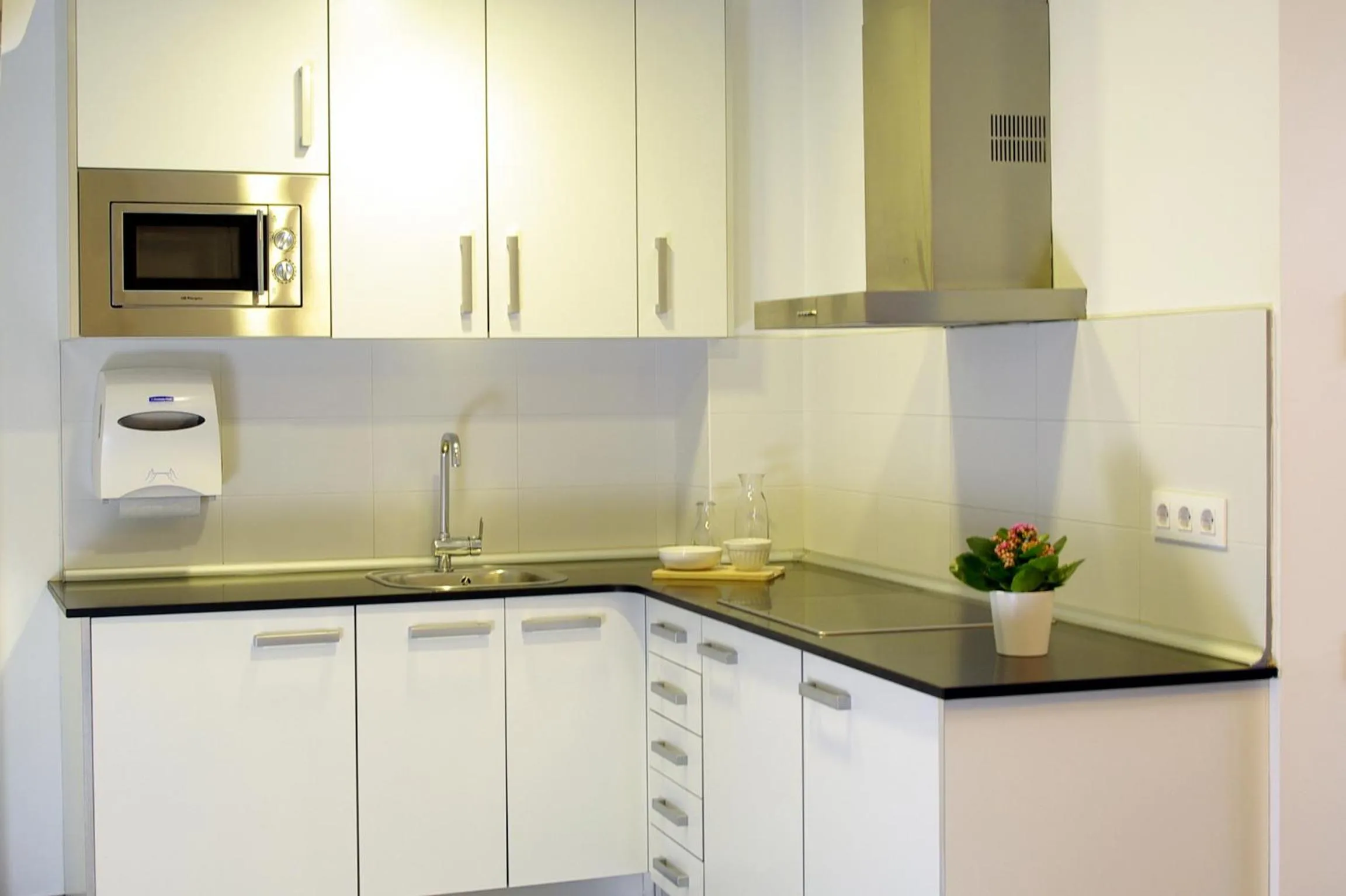 Kitchen or kitchenette in 08028 Apartments