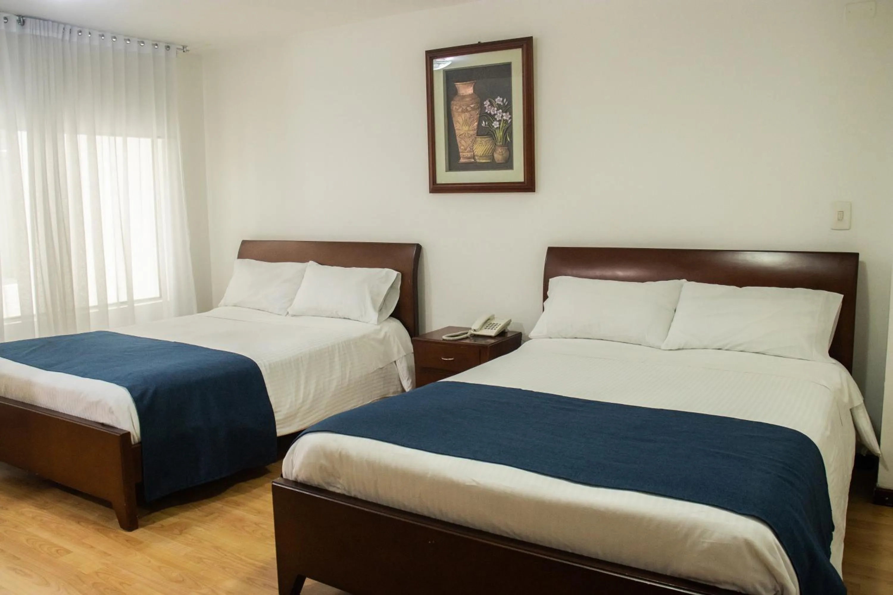Photo of the whole room, Bed in Nogal Suite Hotel Pasto