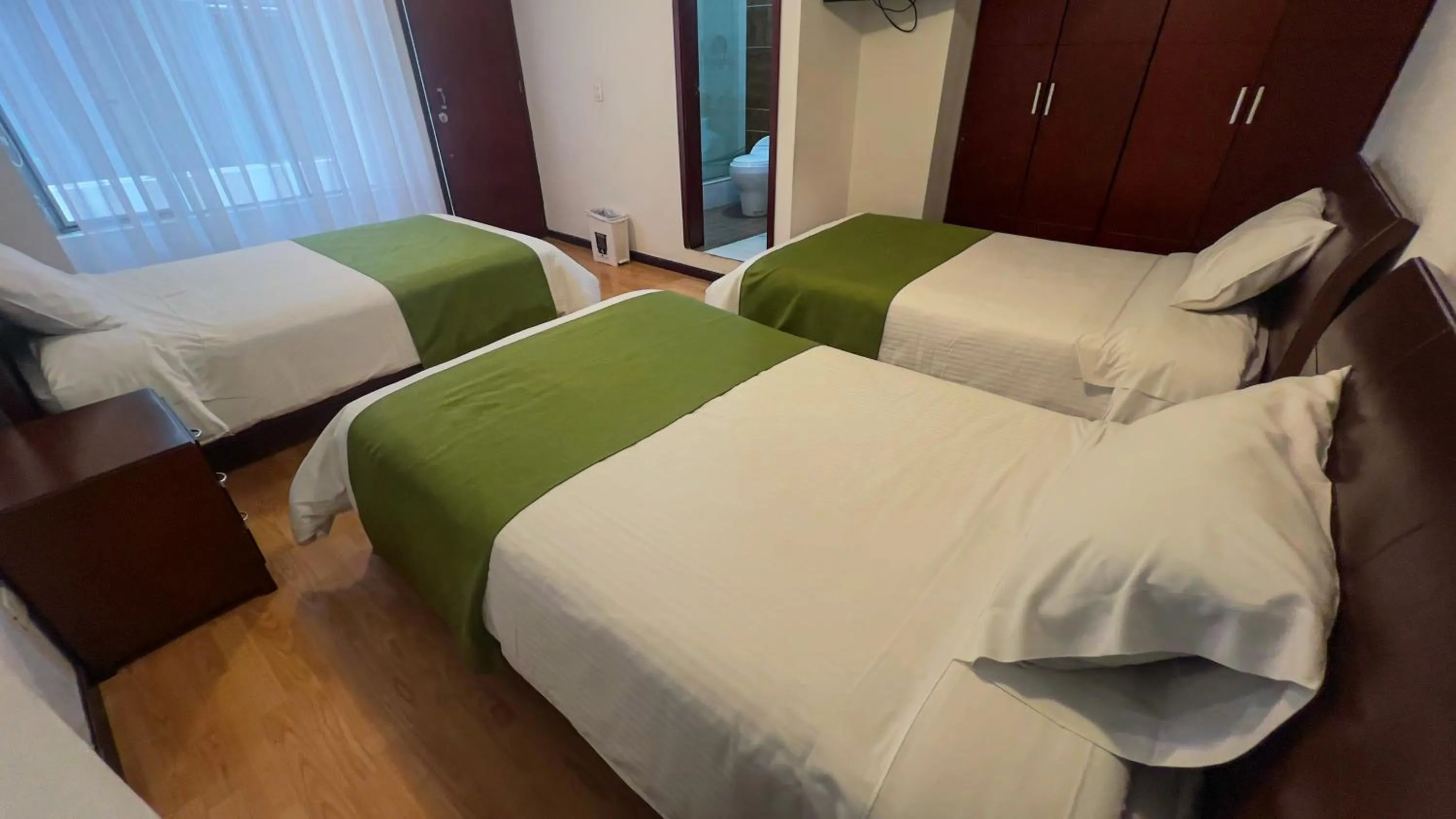 Bed in Nogal Suite Hotel Pasto
