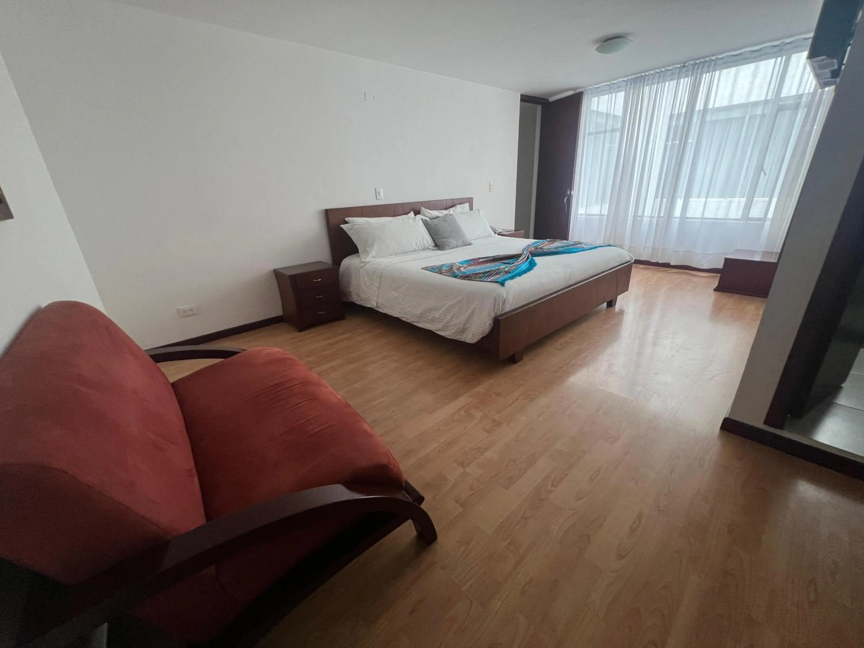 Photo of the whole room, Bed in Nogal Suite Hotel Pasto