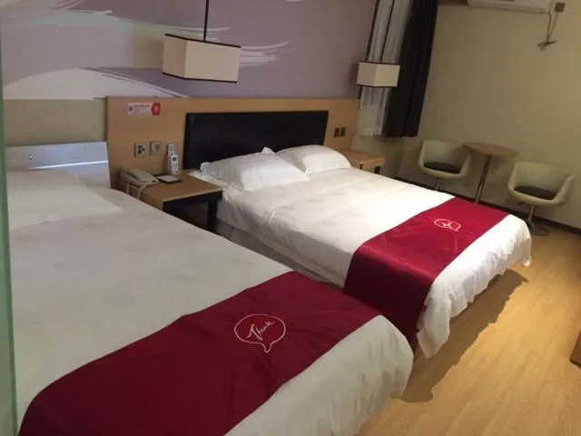 Bed in JUNYI Hotel Jiangsu Nanjing University of Information Science and Technology