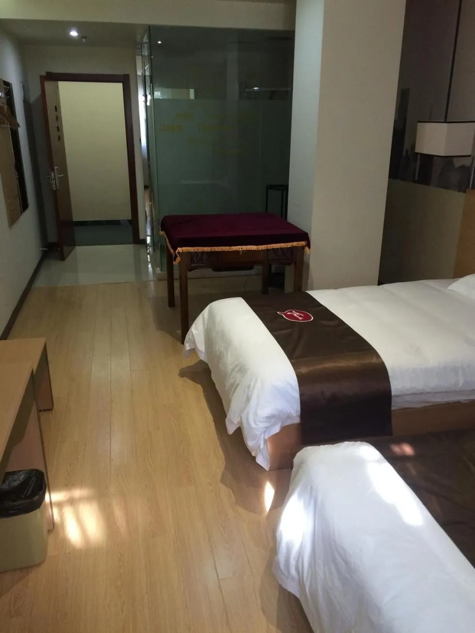 Bed in JUNYI Hotel Jiangsu Nanjing University of Information Science and Technology