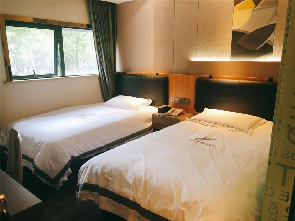 Bed in JUNYI Hotel Nanjing Olympic Sports Center