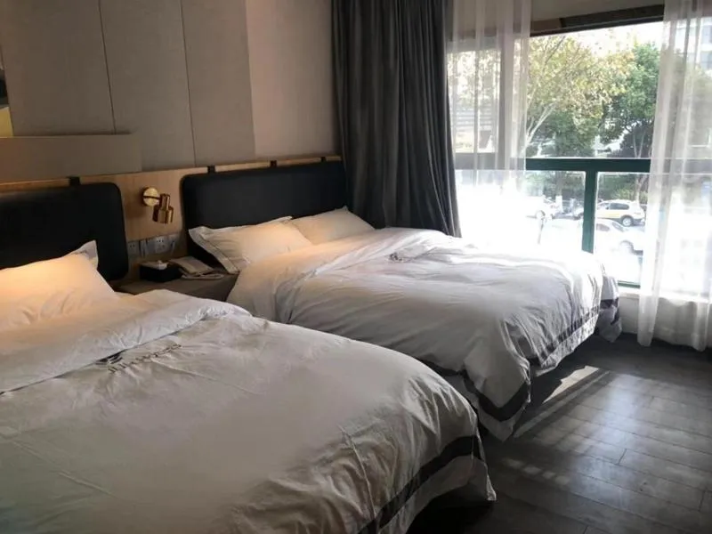 Bed in JUNYI Hotel Nanjing Olympic Sports Center
