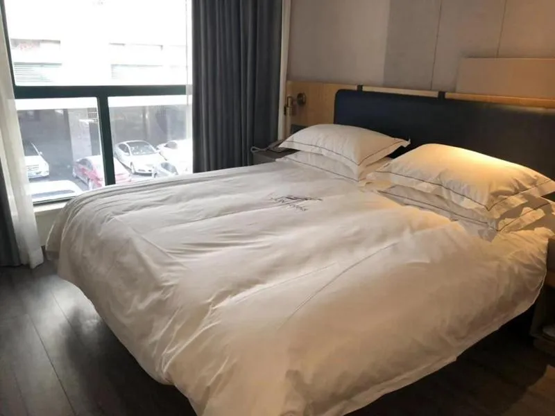 Bed in JUNYI Hotel Nanjing Olympic Sports Center