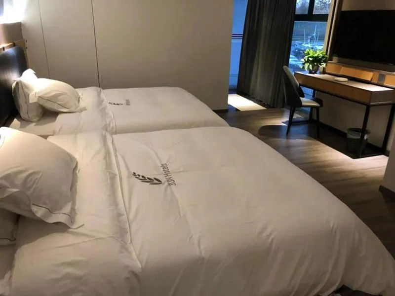 Bed in JUNYI Hotel Nanjing Olympic Sports Center
