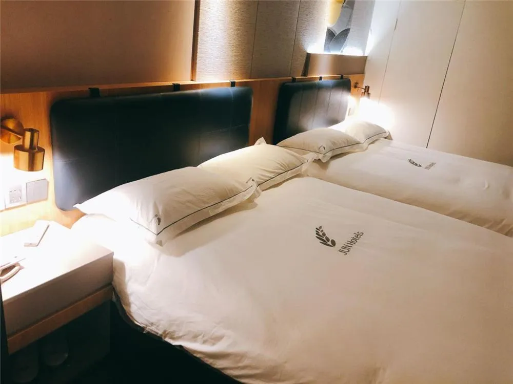 Bed in JUNYI Hotel Nanjing Olympic Sports Center