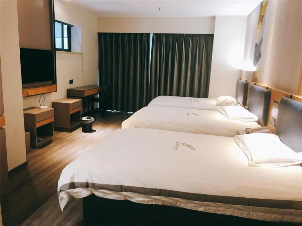 Bed in JUNYI Hotel Nanjing Olympic Sports Center
