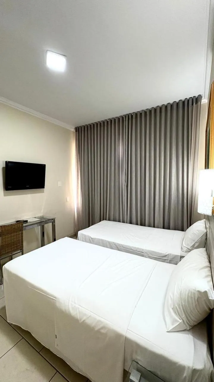 Bed in HOTEL DEL REY CURITIBA by POTY - NA FAMOSA RUA XV DE NOVEMBRO