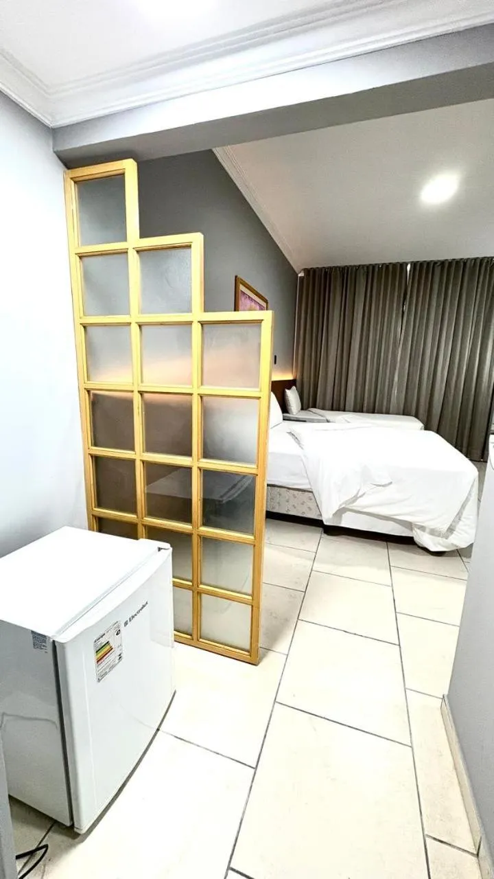 Bed in HOTEL DEL REY CURITIBA by POTY - NA FAMOSA RUA XV DE NOVEMBRO