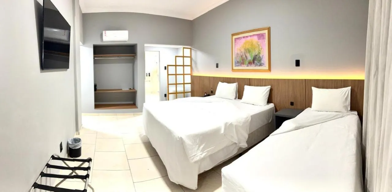 Bed in HOTEL DEL REY CURITIBA by POTY - NA FAMOSA RUA XV DE NOVEMBRO