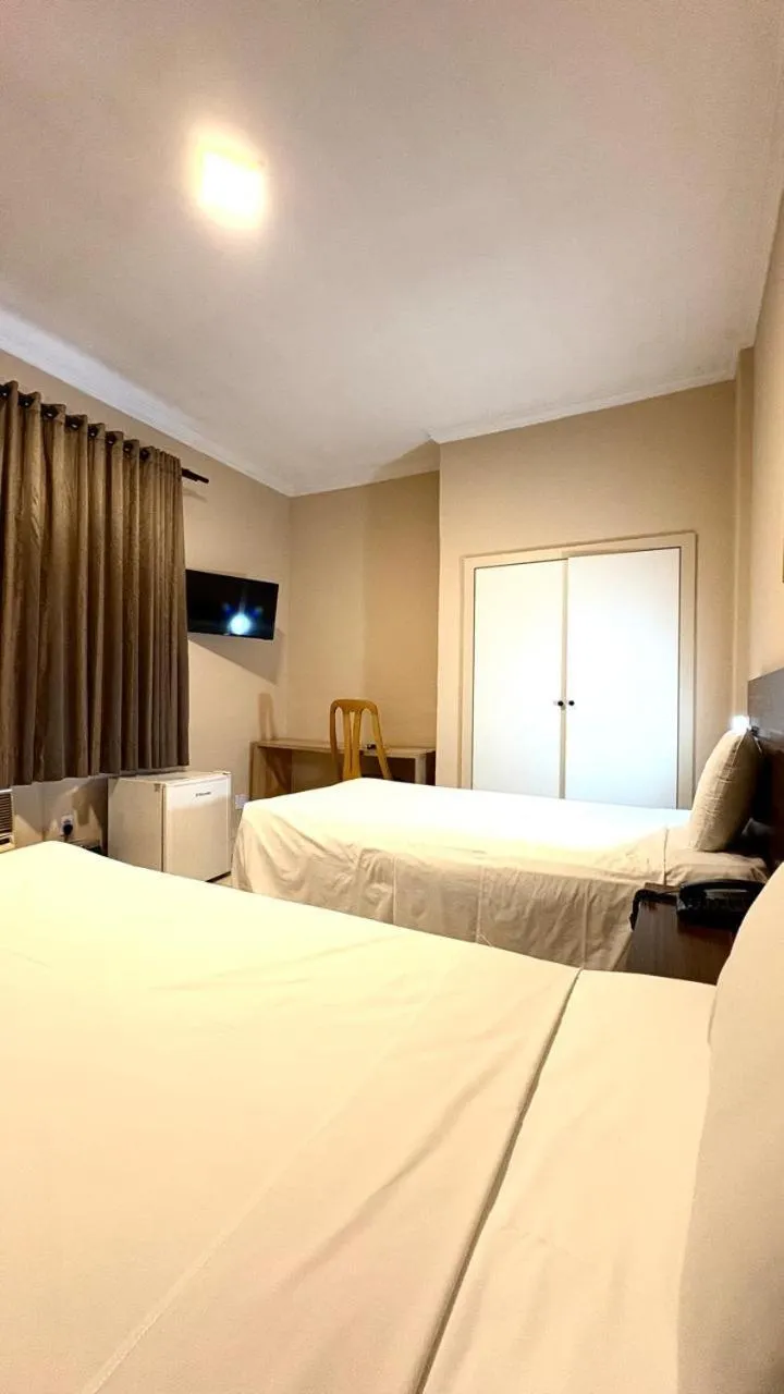 Bed in HOTEL DEL REY CURITIBA by POTY - NA FAMOSA RUA XV DE NOVEMBRO