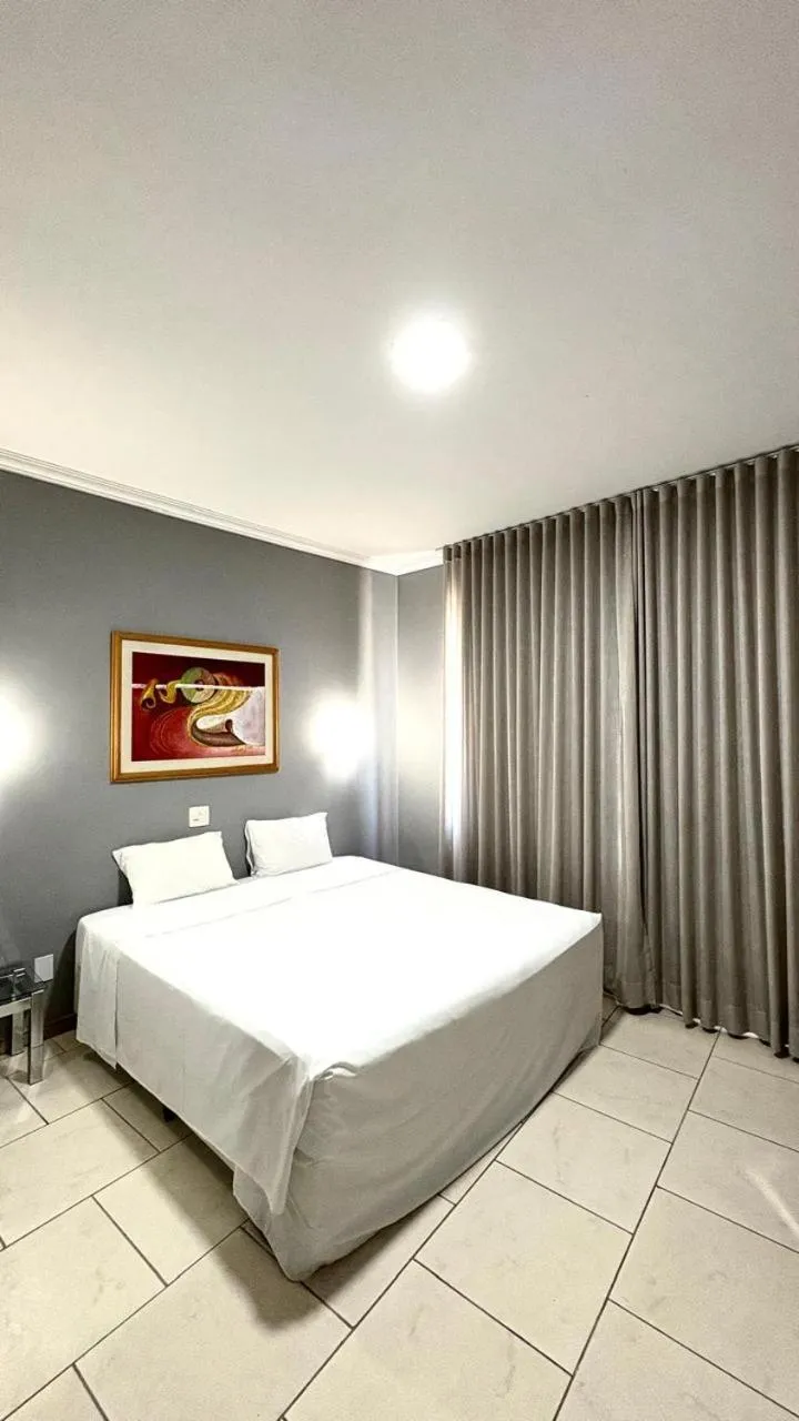 Bed in HOTEL DEL REY CURITIBA by POTY - NA FAMOSA RUA XV DE NOVEMBRO