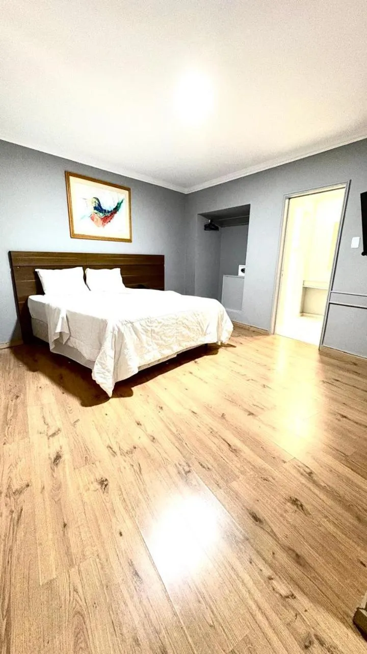 Bed in HOTEL DEL REY CURITIBA by POTY - NA FAMOSA RUA XV DE NOVEMBRO