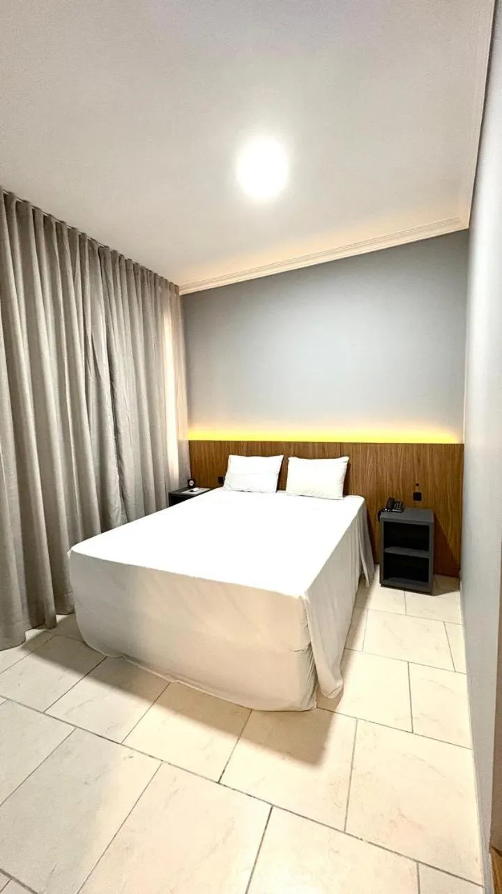 Bed in HOTEL DEL REY CURITIBA by POTY - NA FAMOSA RUA XV DE NOVEMBRO