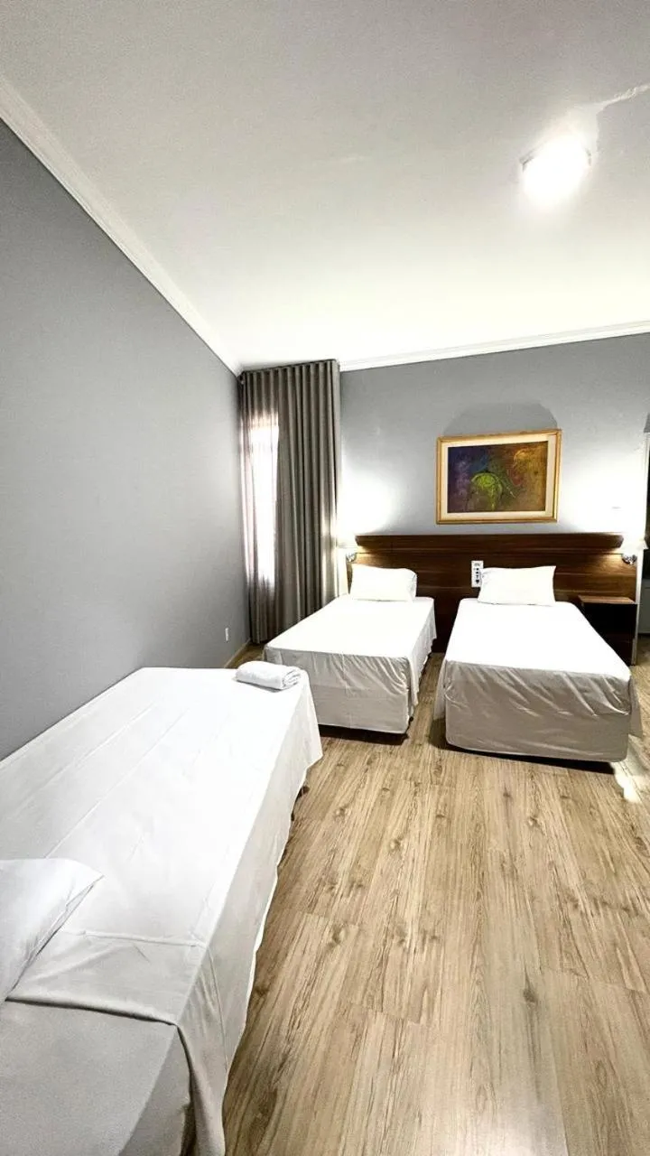 Bed in HOTEL DEL REY CURITIBA by POTY - NA FAMOSA RUA XV DE NOVEMBRO