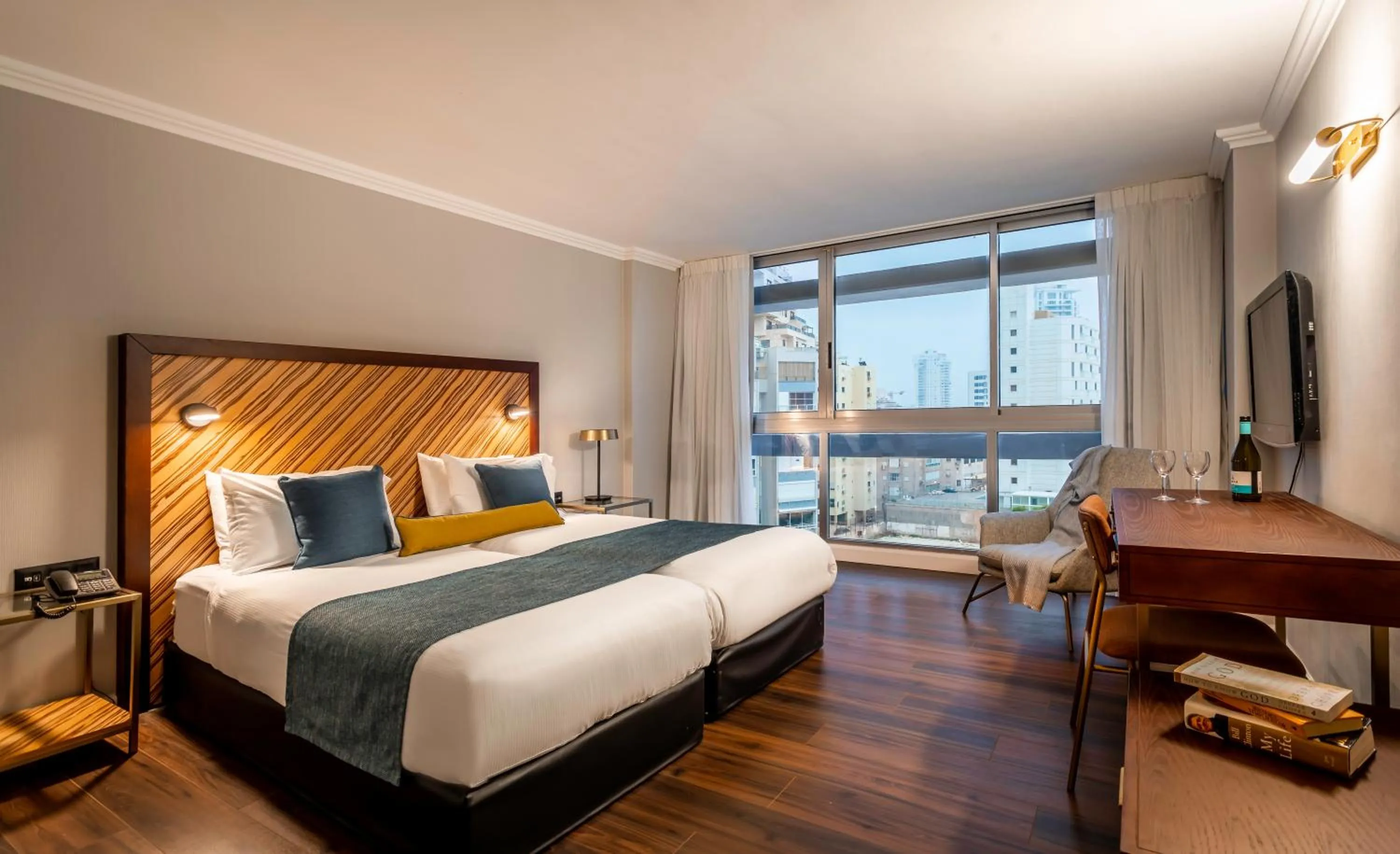 Bed in The Seasons Hotel -Studio & Suite